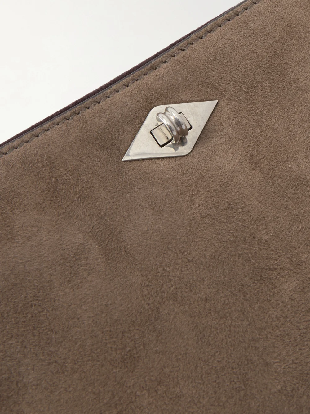 Close-up detail of the Métier Ease 28 Suede Clutch