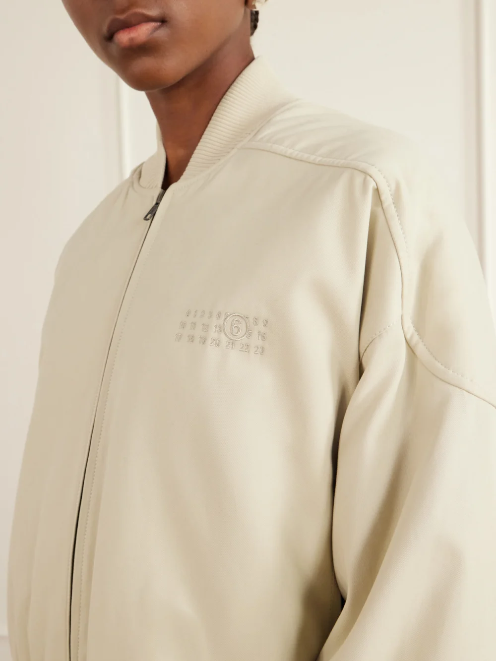 Close-up detail of the MM6 Maison Margiela Embroidered Cotton Bomber Jacket