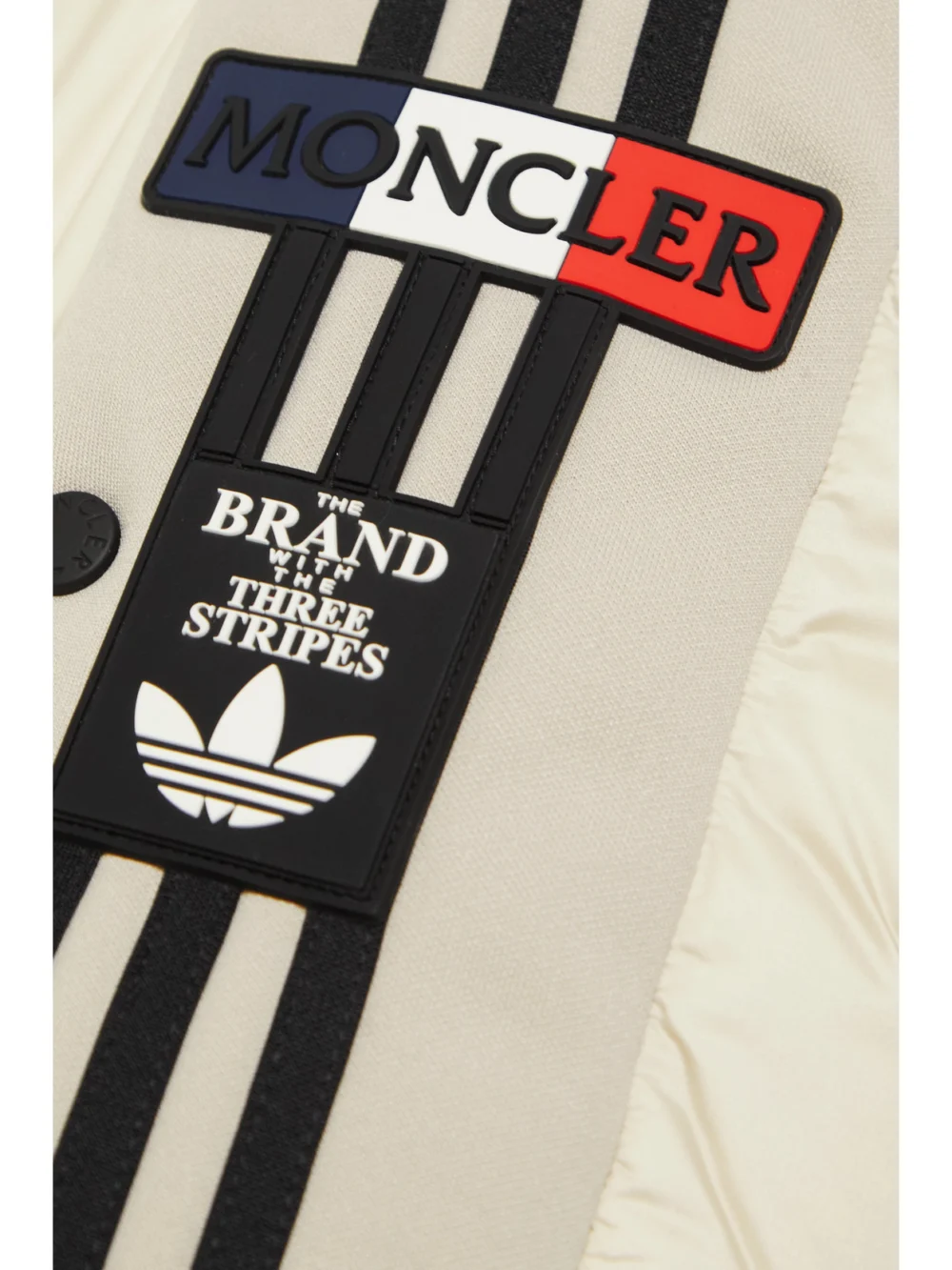 Close-up detail of the Moncler Genius + Adidas Originals Cropped Hooded Striped Quilted Shell Down Jacket