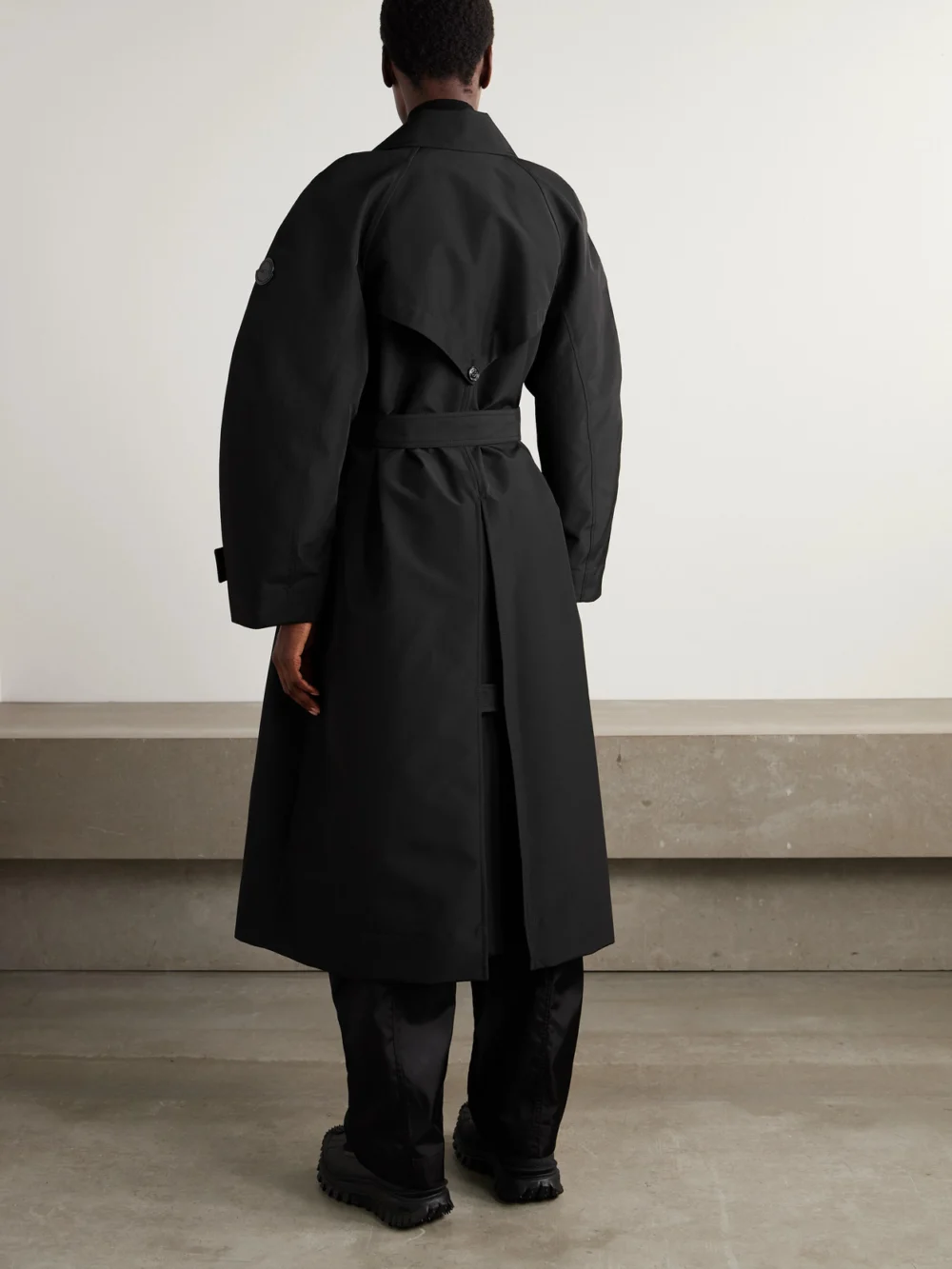 Back view of the Moncler Genius + Edward Enninful Zake Belted Double-breasted Shell Trench Coat