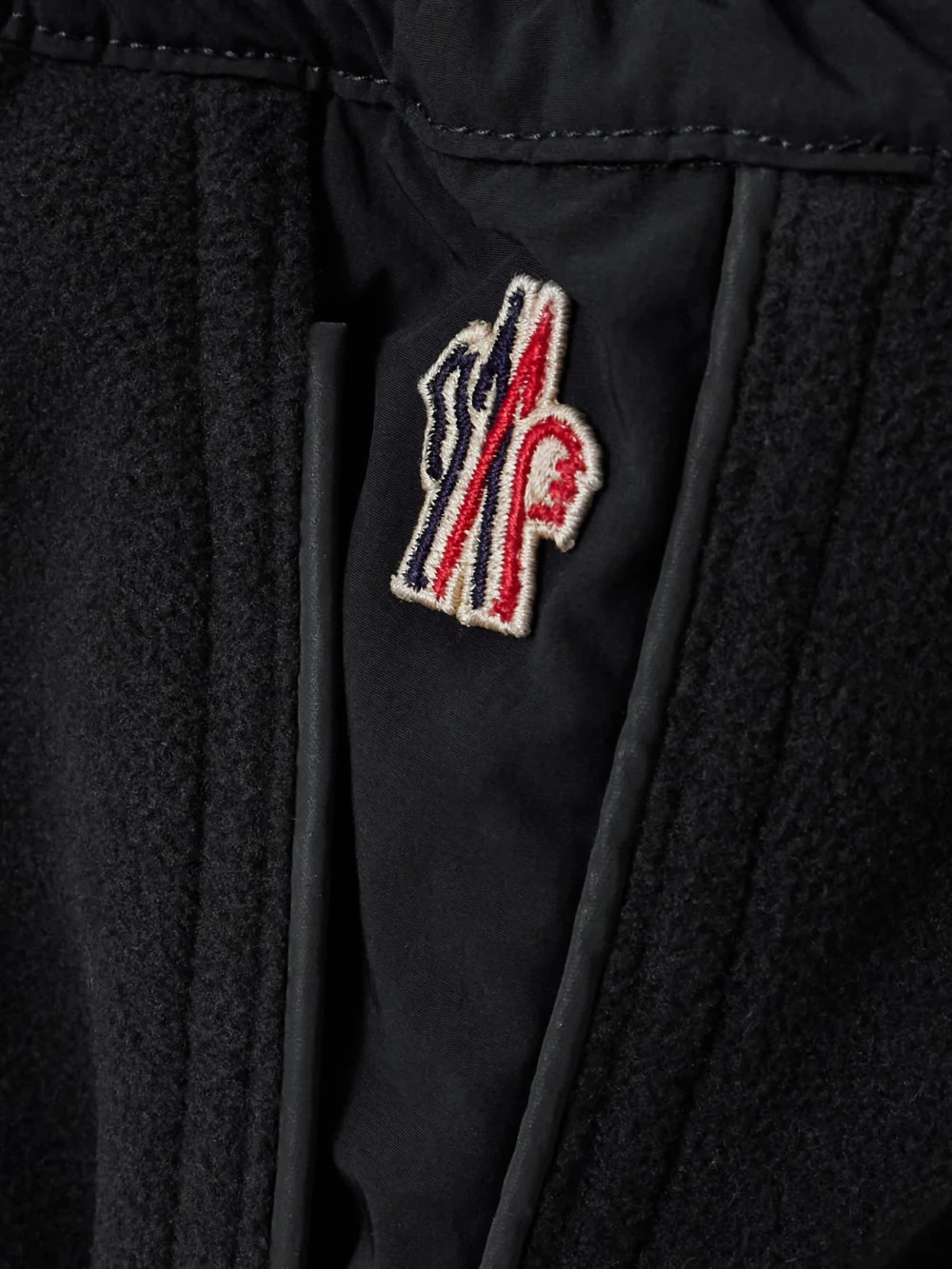 Close-up detail of the Moncler Grenoble Shell-paneled Fleece Tapered Sweatpants