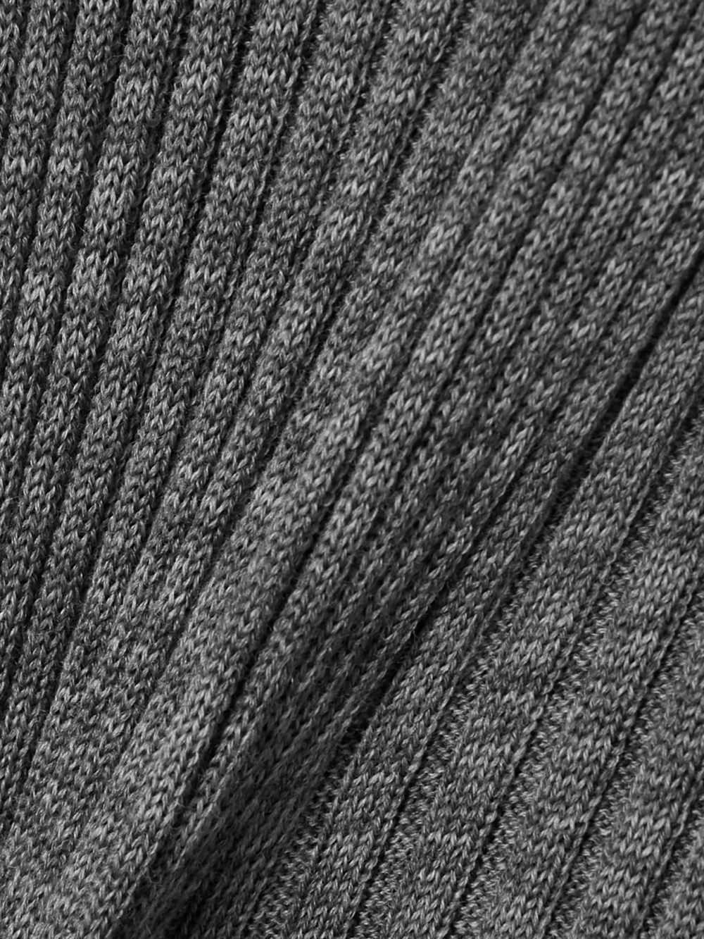 Close-up detail of the Moncler Ribbed Wool Turleneck Midi Dress