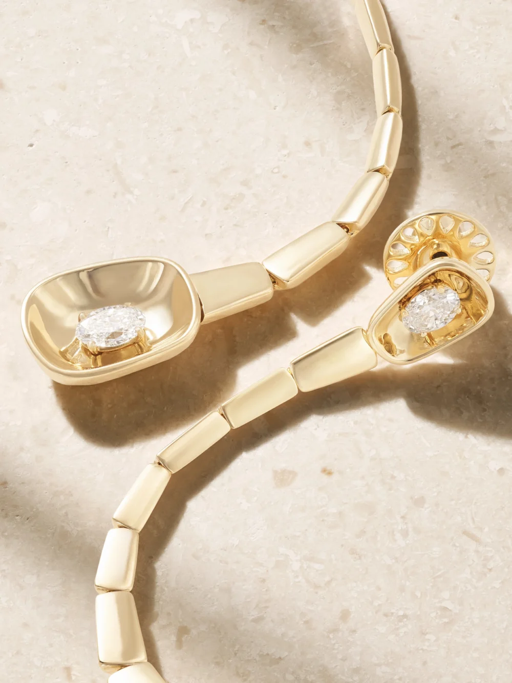 Close-up detail of the Nikos Koulis Look 18-karat Gold Diamond Earrings
