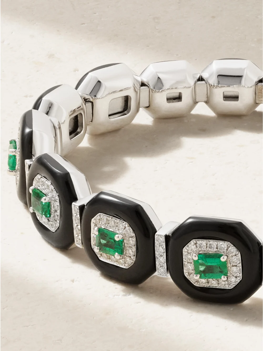 Close-up detail of the Nikos Koulis Oui 18-karat White Gold, Emerald, Diamond and Enamel Bangle