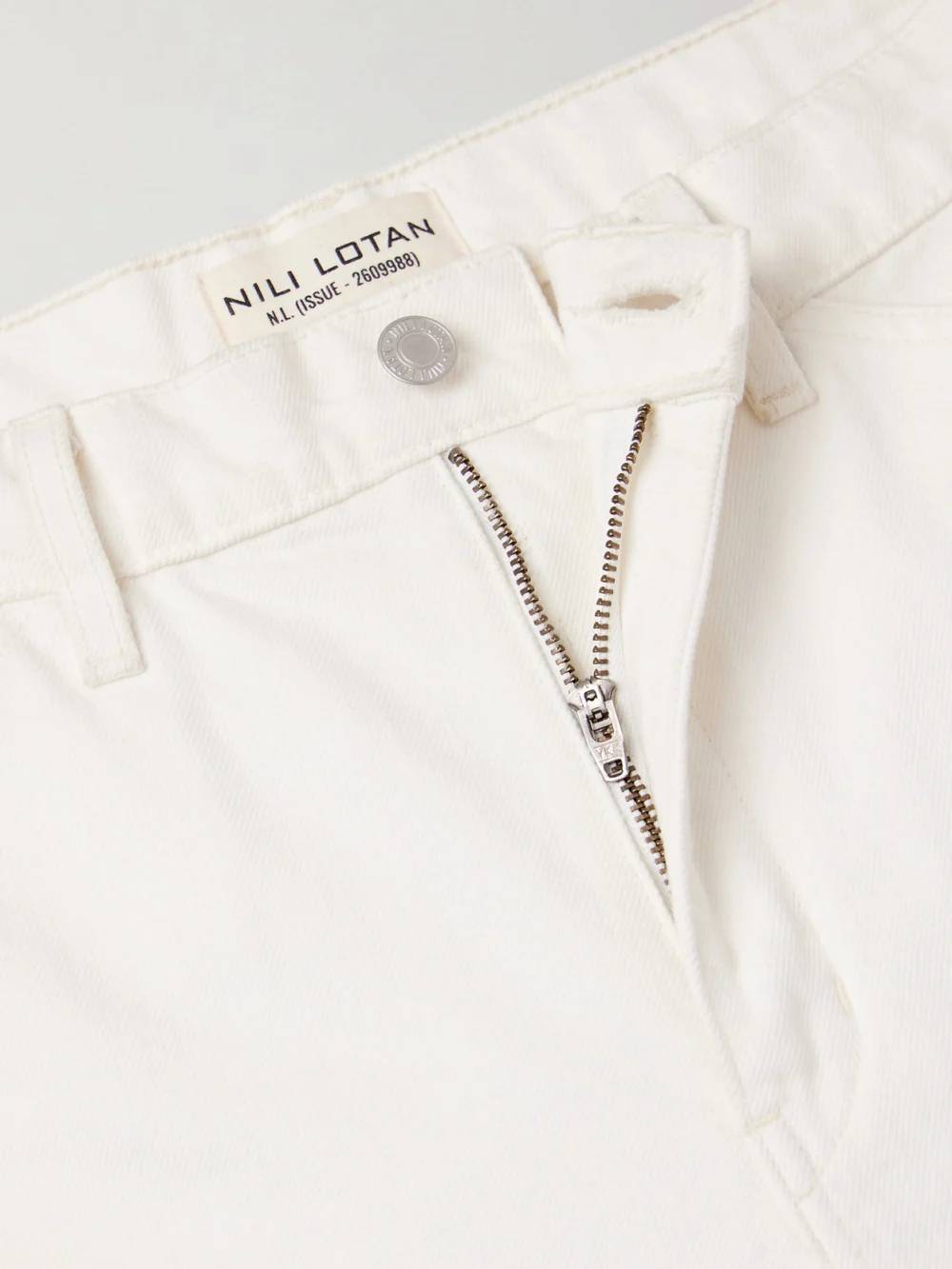 Close-up detail of the Nili Lotan Tribeca High-rise Barrel-leg Jeans