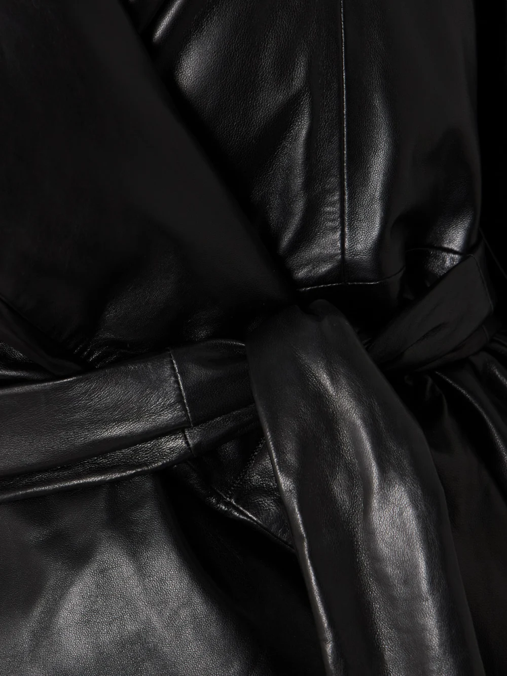 Close-up detail of the Nour Hammour Cora Belted Padded Leather Coat