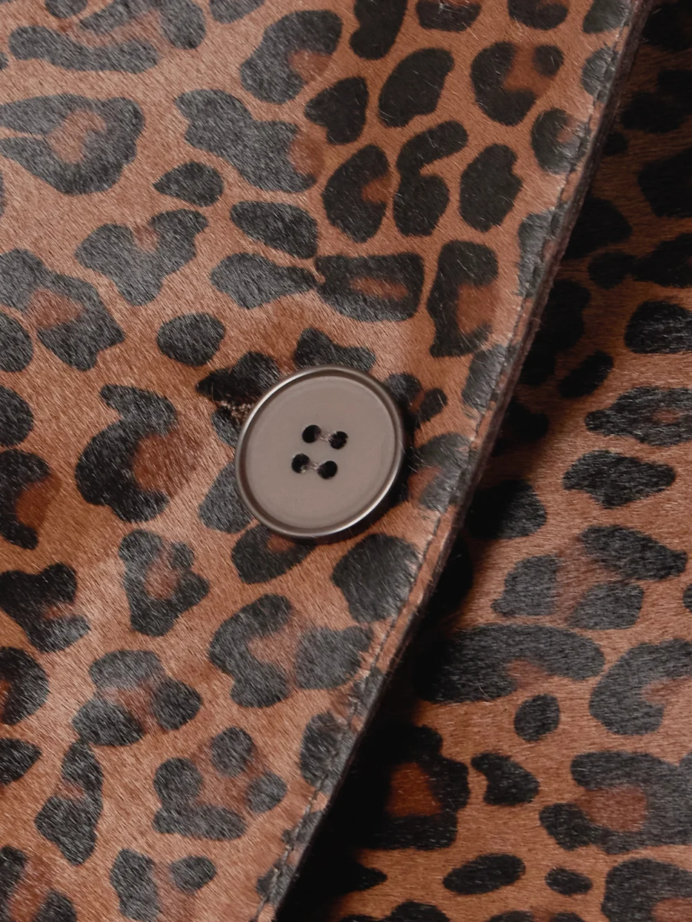 Close-up detail of the Nour Hammour Leopard-print Calf Hair Coat