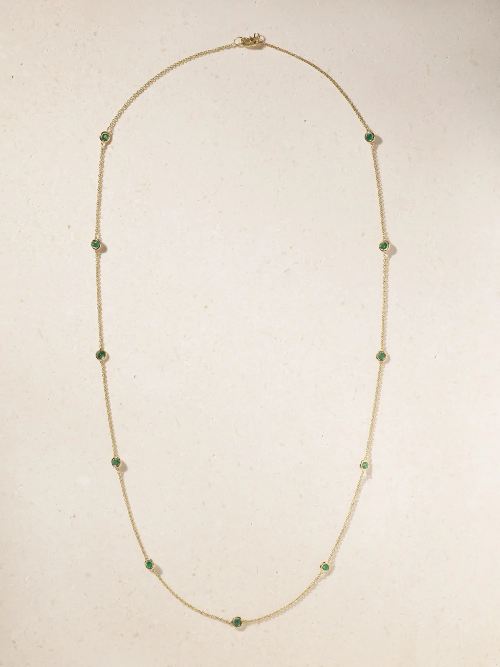 Close-up detail of the Octavia Elizabeth By the Pinch 18-karat Gold Emerald Necklace