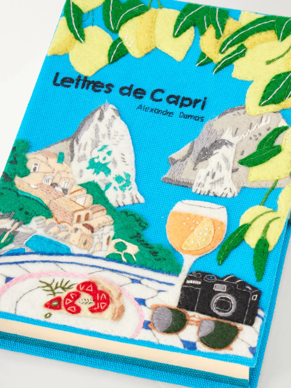 Close-up detail of the Olympia Le-Tan Lettres De Capri Embroidered Canvas Clutch