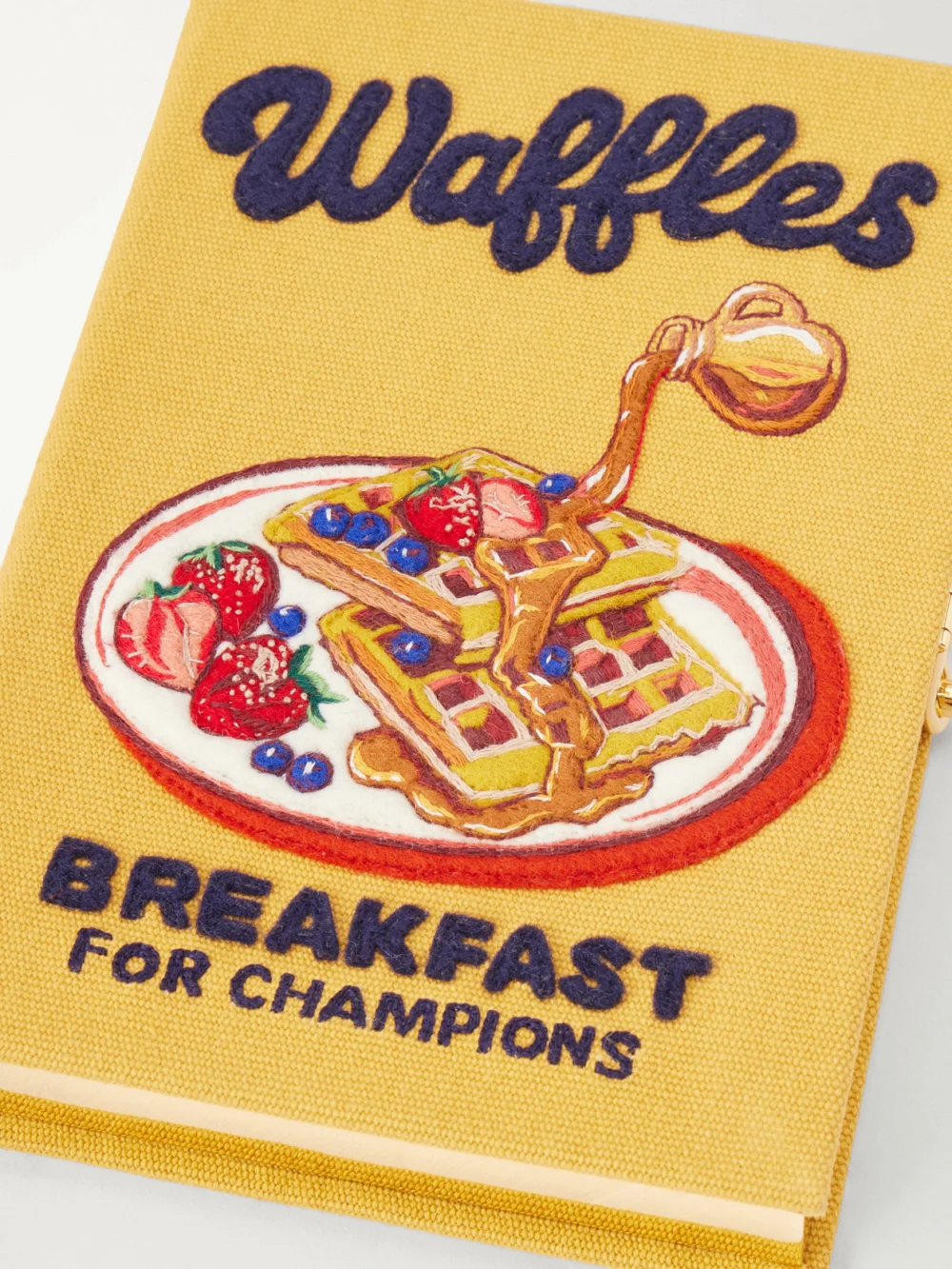 Close-up detail of the Olympia Le-Tan Waffles: Breakfast for Champions Embroidered Canvas Clutch