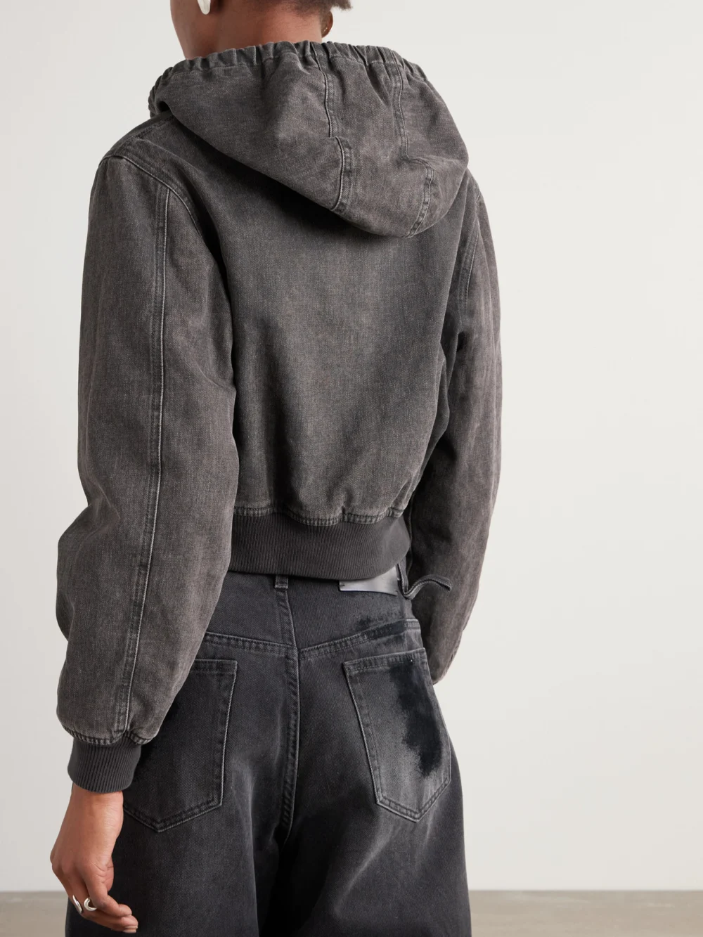 Back view of the Our Legacy Cropped Hooded Denim Jacket