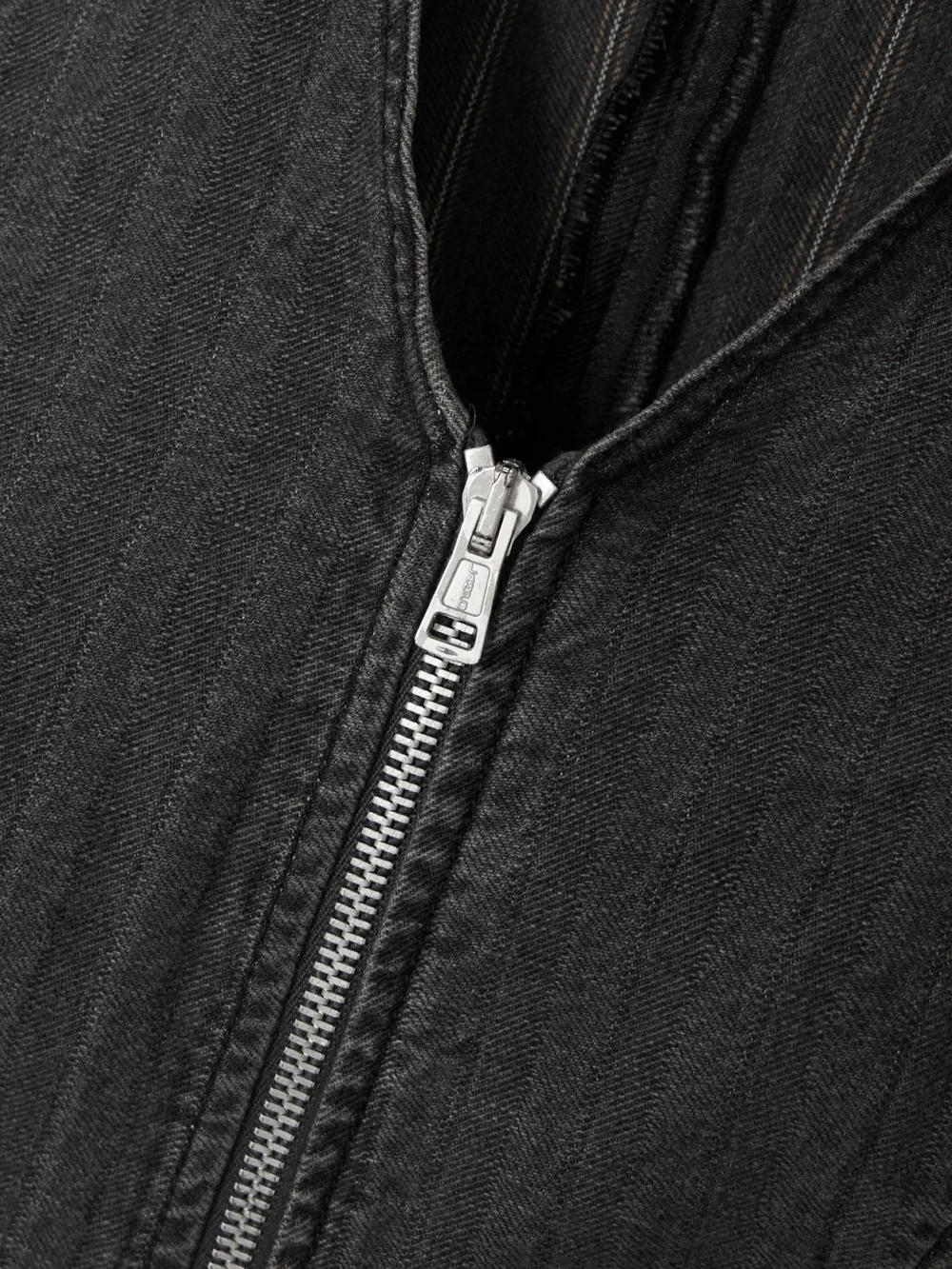 Close-up detail of the Our Legacy Zip-detailed Striped Denim Tank