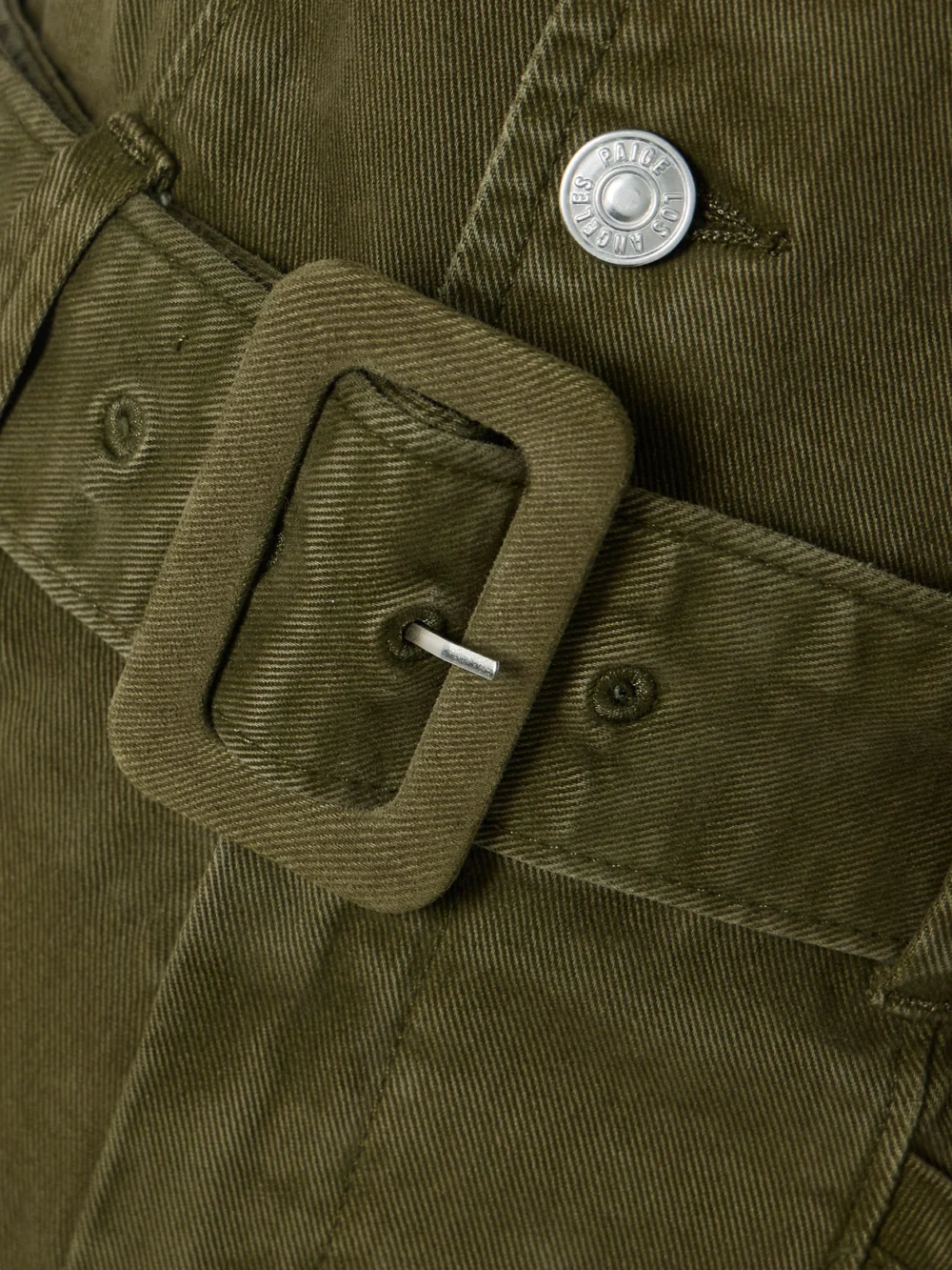 Close-up detail of the Paige Sasha Belted Denim Jumpsuit