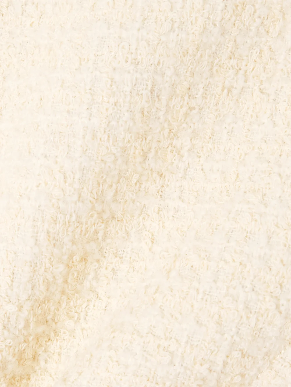 Close-up detail of the Patou Belted Appliquéd Wool-blend Tweed Jacket