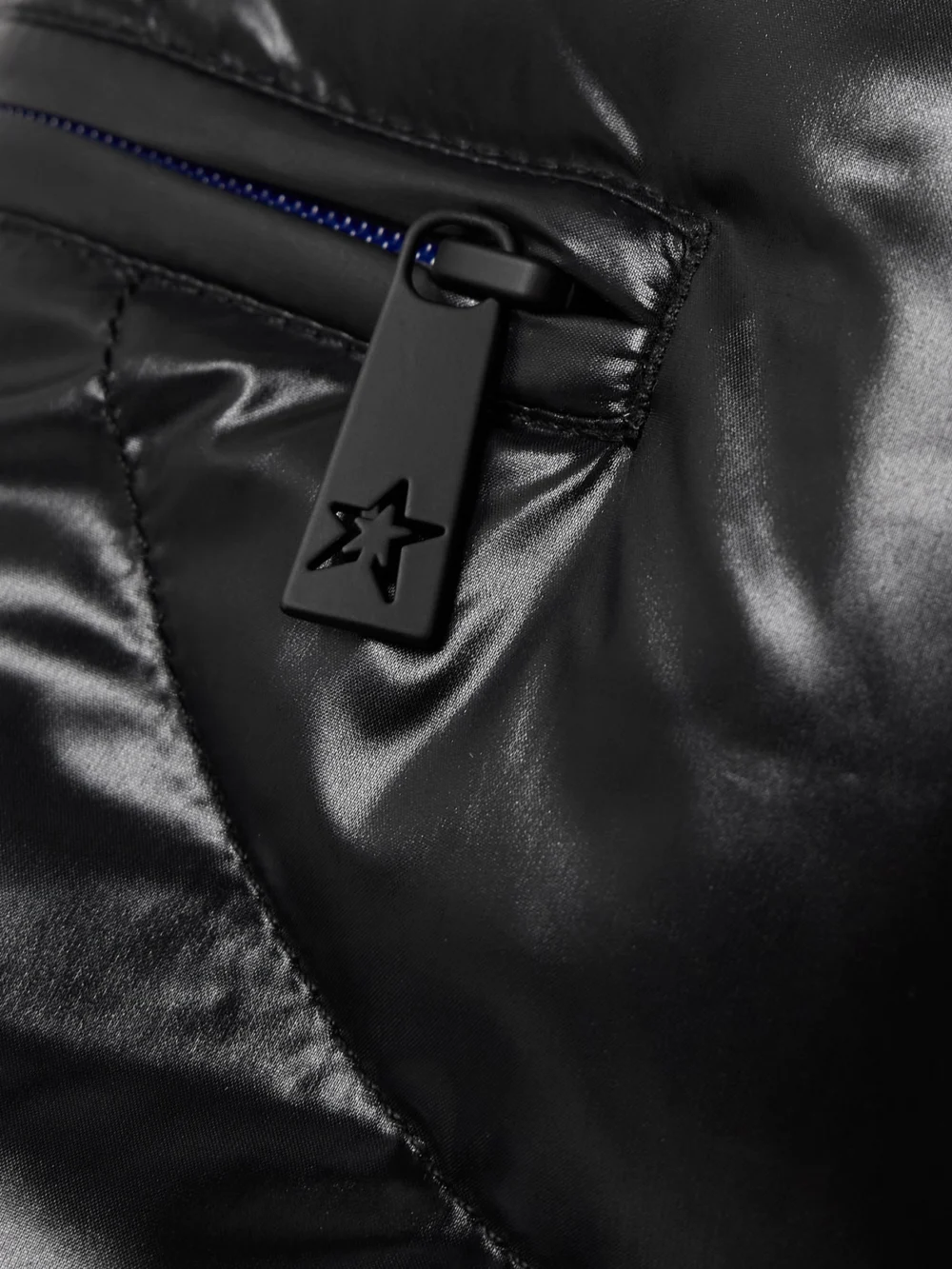 Close-up detail of the Perfect Moment + Johnnie Walker Carving Air Quilted Bootcut Ski Pants
