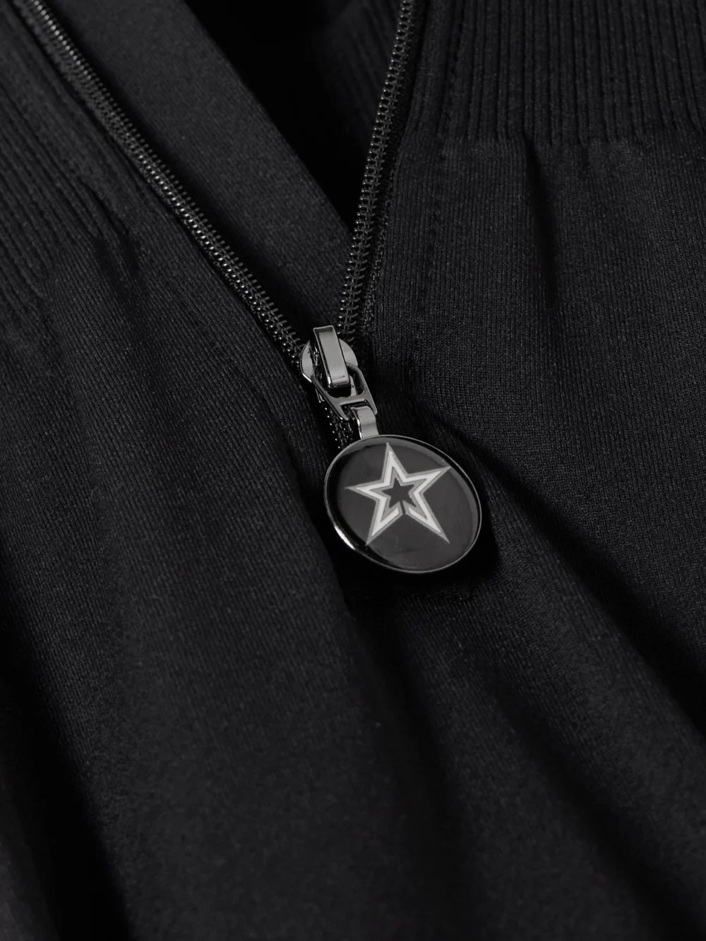 Close-up detail of the Perfect Moment Stretch-knit Ski Jumpsuit