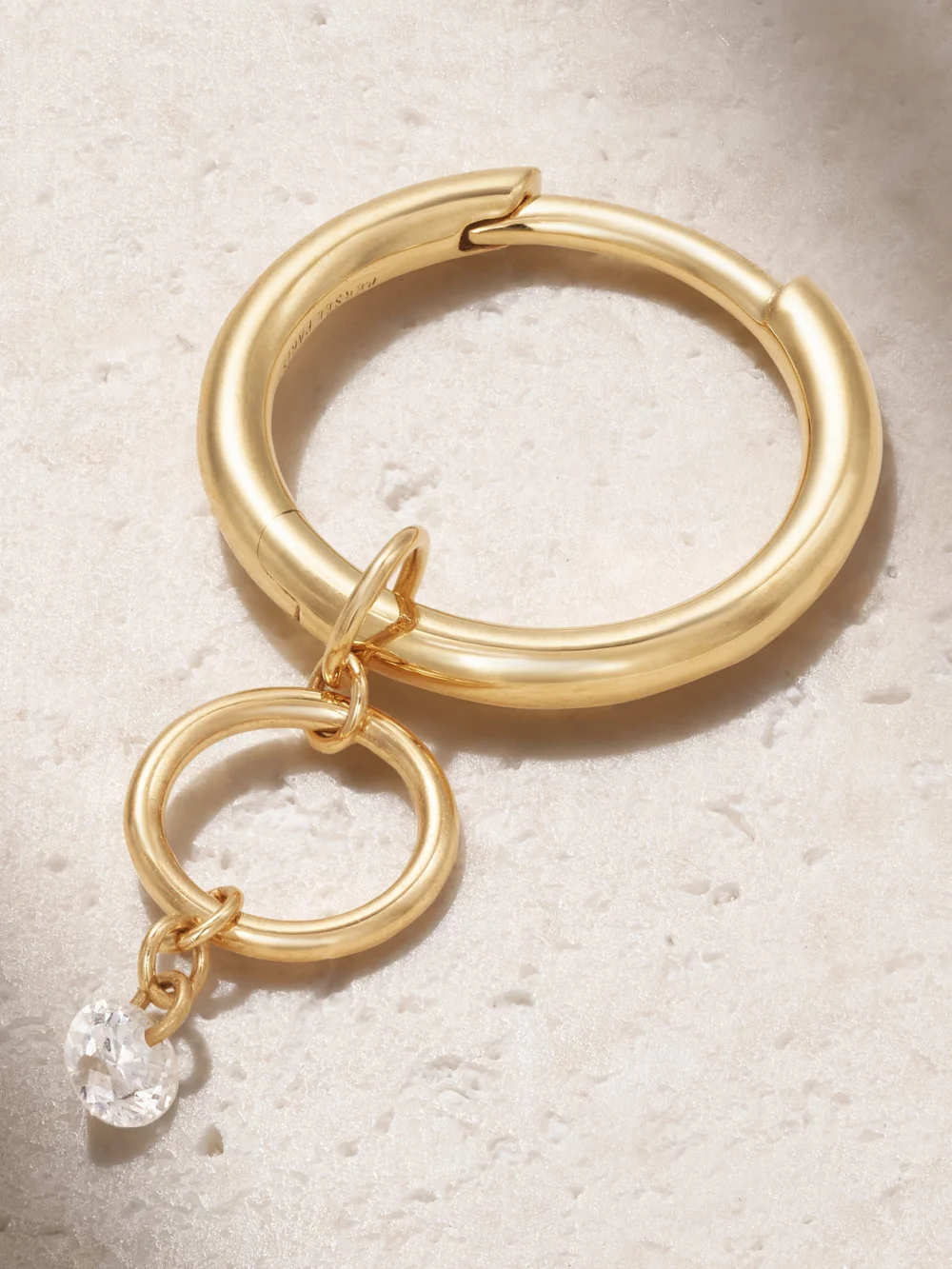 Close-up detail of the Persée Circles 18-karat Gold Diamond Single Hoop Earring