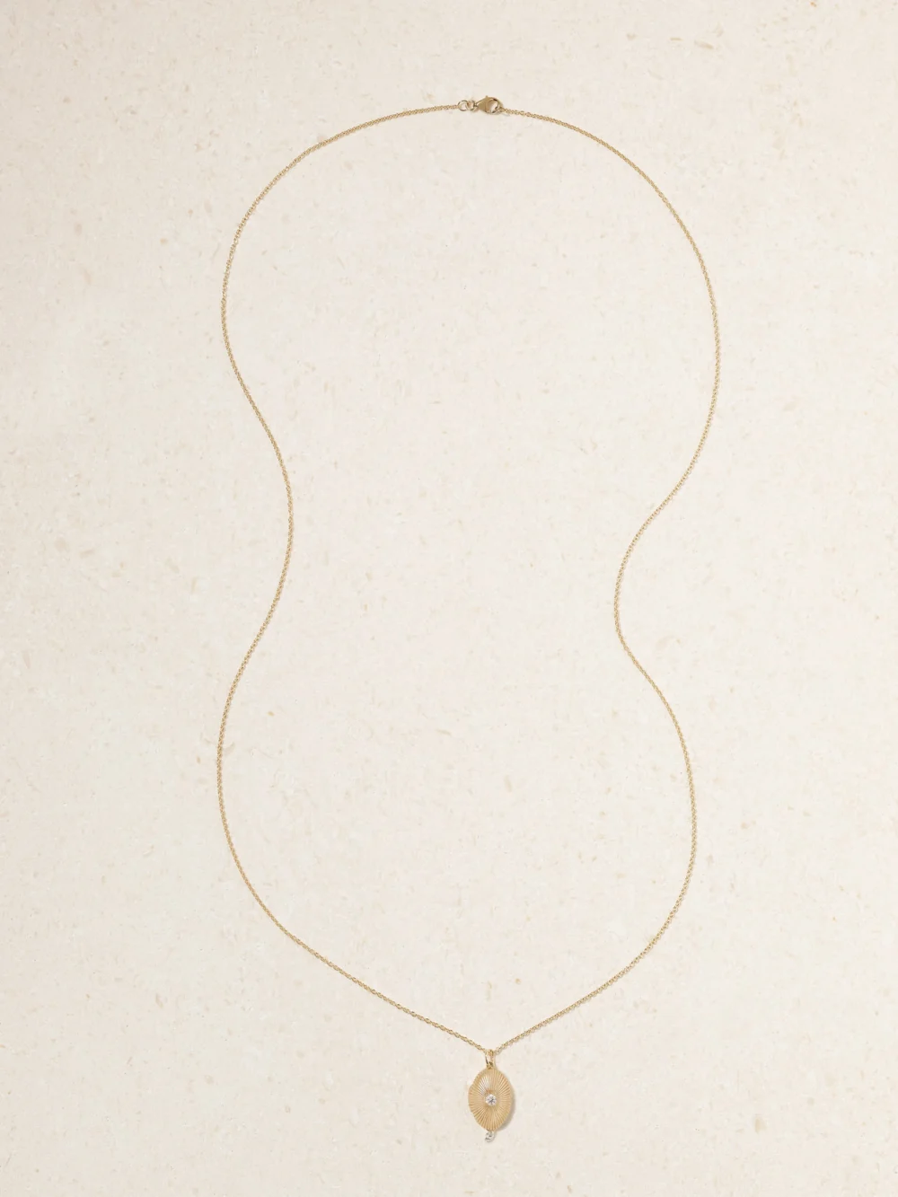 Close-up detail of the Persée Locket 9-karat Gold Diamond Necklace