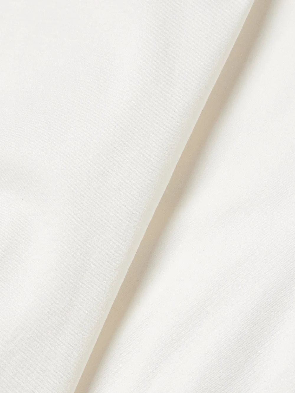 Close-up detail of the Proenza Schouler Lynn Gathered Organic Cotton-jersey Midi Wrap Dress