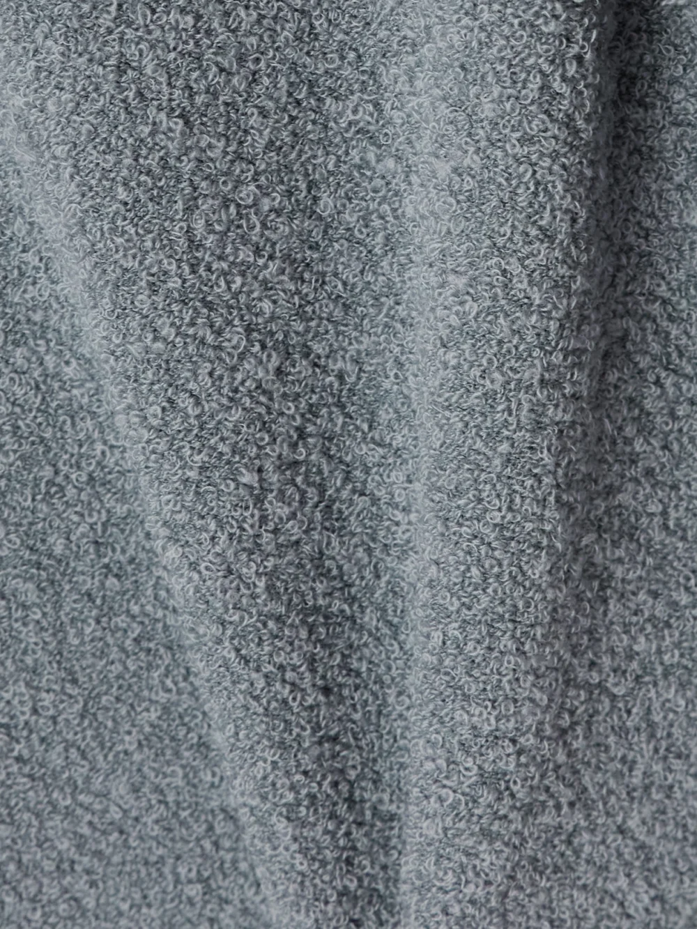 Close-up detail of the Proenza Schouler Toni Cut-out Fringed Bouclé Maxi Dress