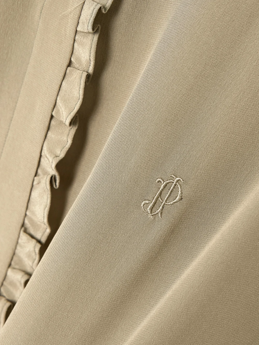 Close-up detail of the Purdey Ruffled Embroidered Silk Blouse