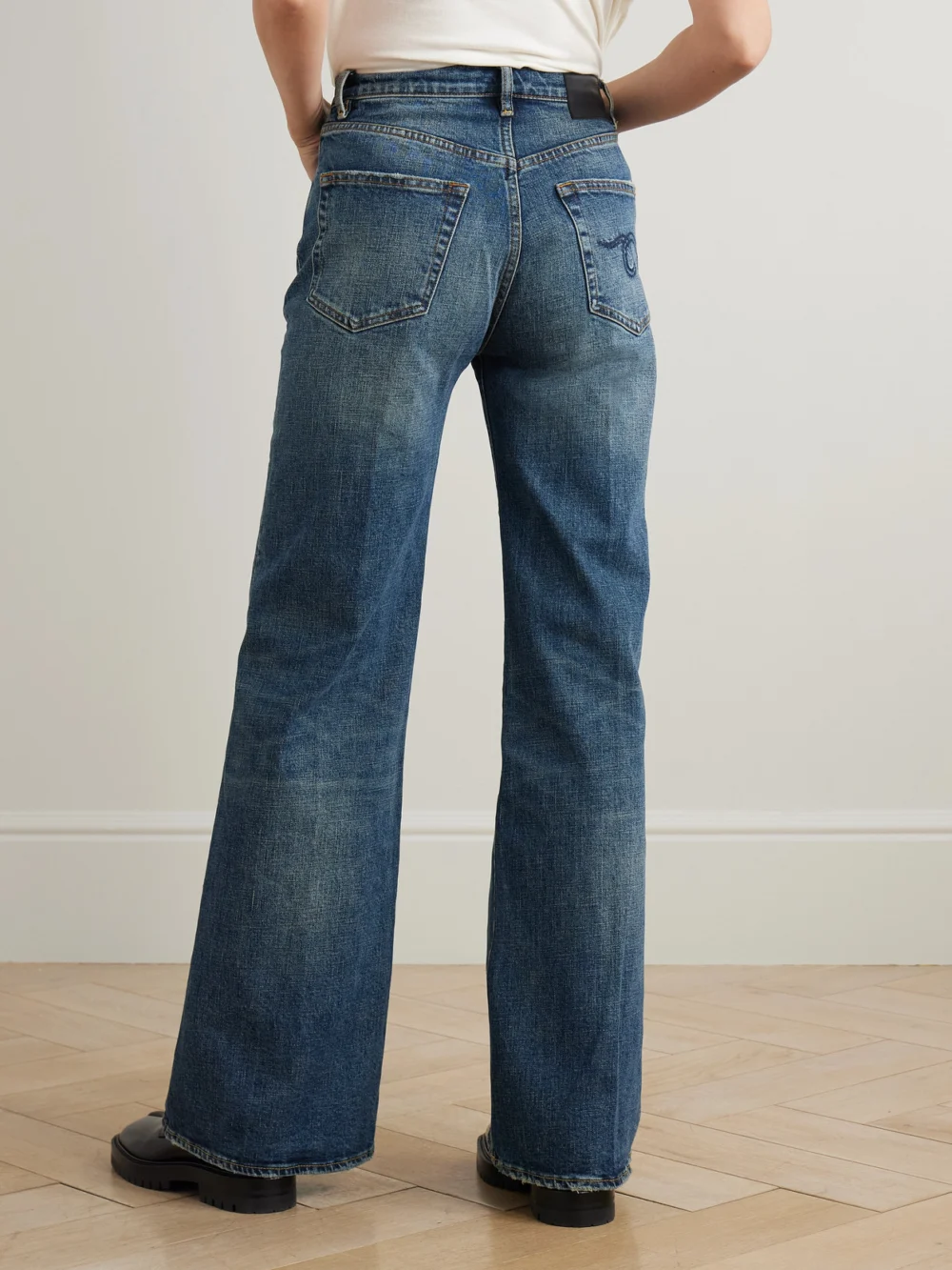 Back view of the R13 Charlotte Distressed High-rise Flared Jeans
