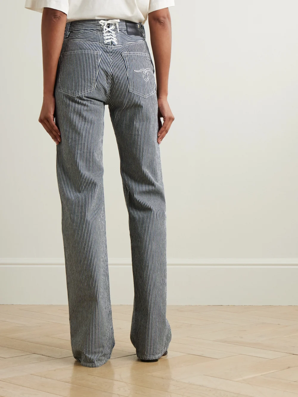 Back view of the R13 Lace Back Jane Striped High-rise Wide-leg Jeans