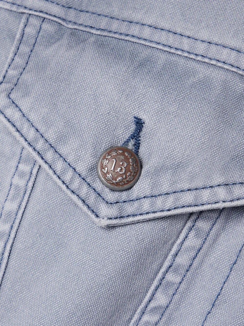 Close-up detail of the R13 Lacey Denim Jacket