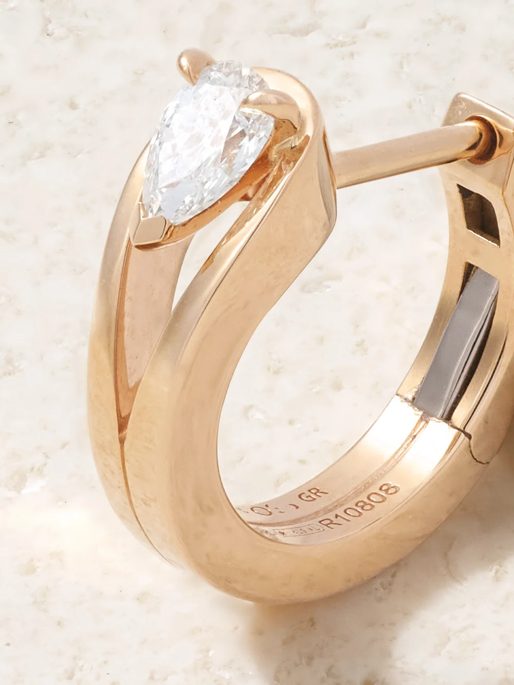 Close-up detail of the Repossi Serti Inversé 18-karat Rose Gold Diamond Single Earring