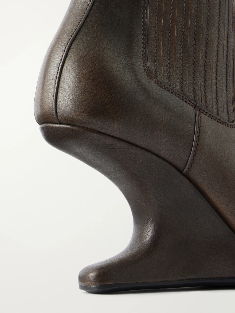 Close-up detail of the Rick Owens Cantilever 80 Curved Leather Wedge Ankle Boots
