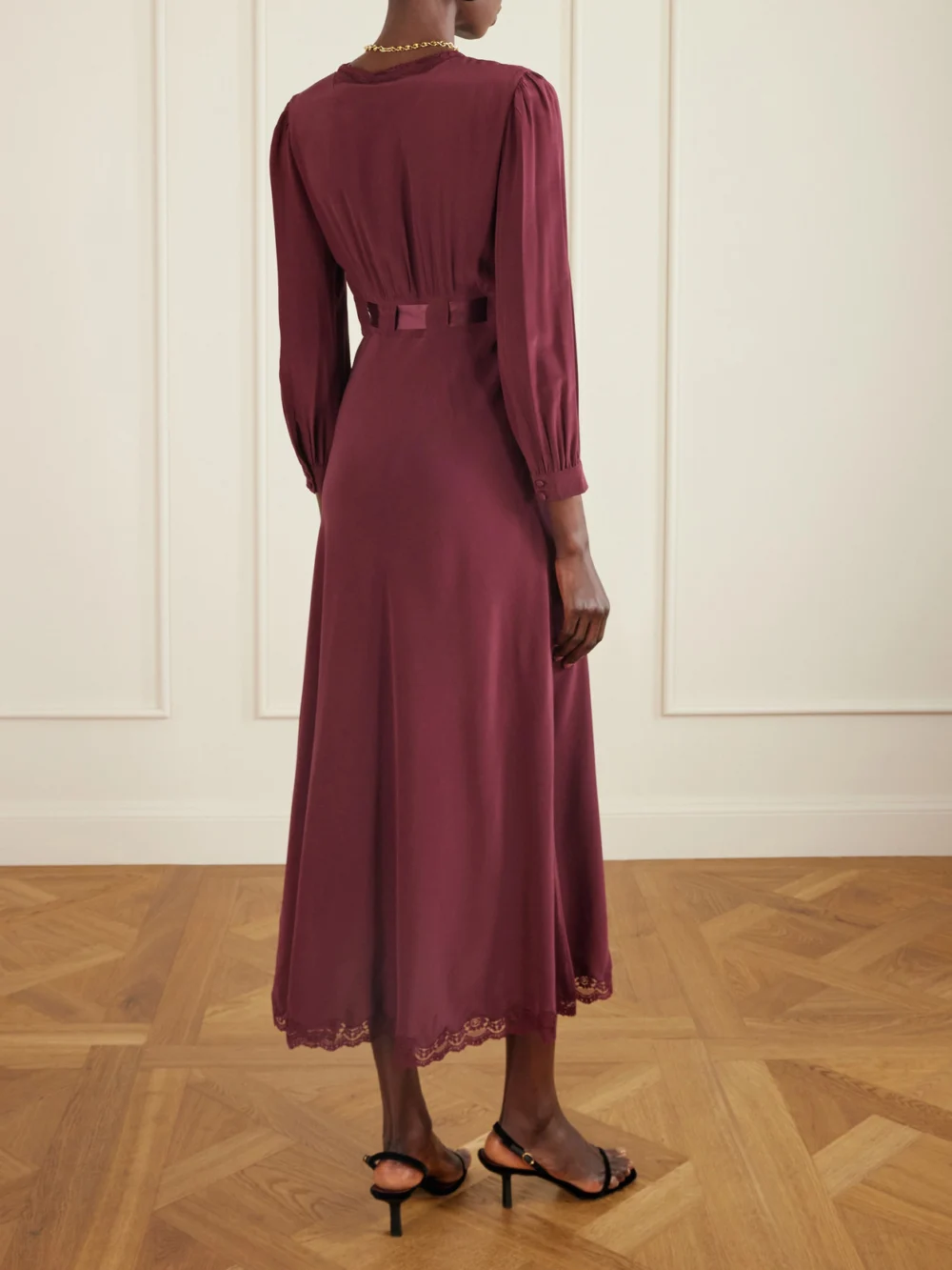 Back view of the Rixo Adaline Bow-detailed Lace-trimmed Silk Maxi Dress