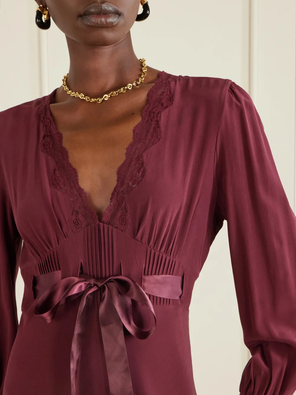 Close-up detail of the Rixo Adaline Bow-detailed Lace-trimmed Silk Maxi Dress