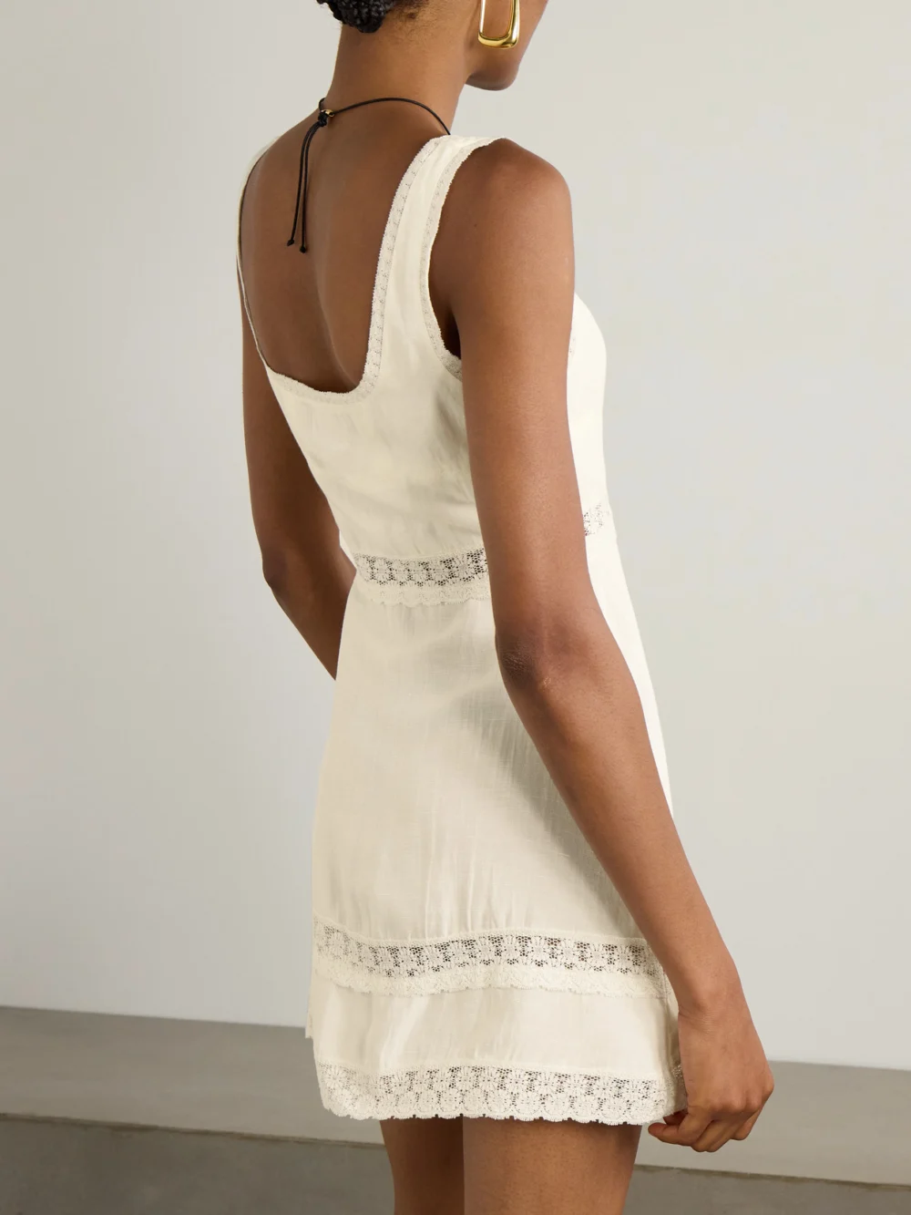 Back view of the Rixo Ronan Lace-trimmed Crepe Mini Dress