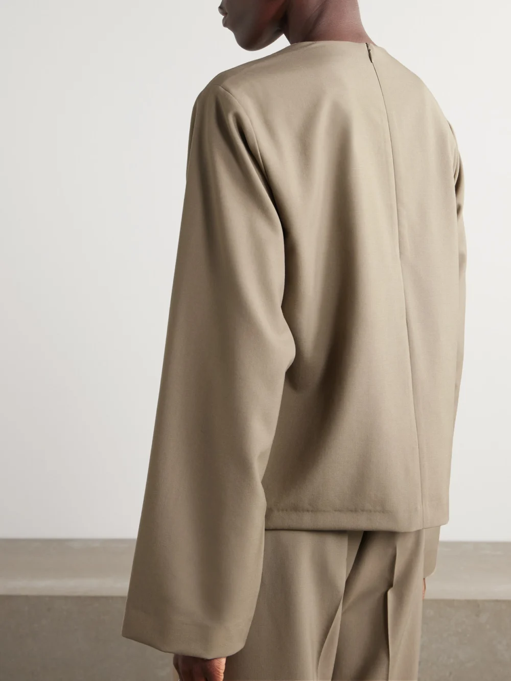 Back view of the Róhe Draped Wool Blouse