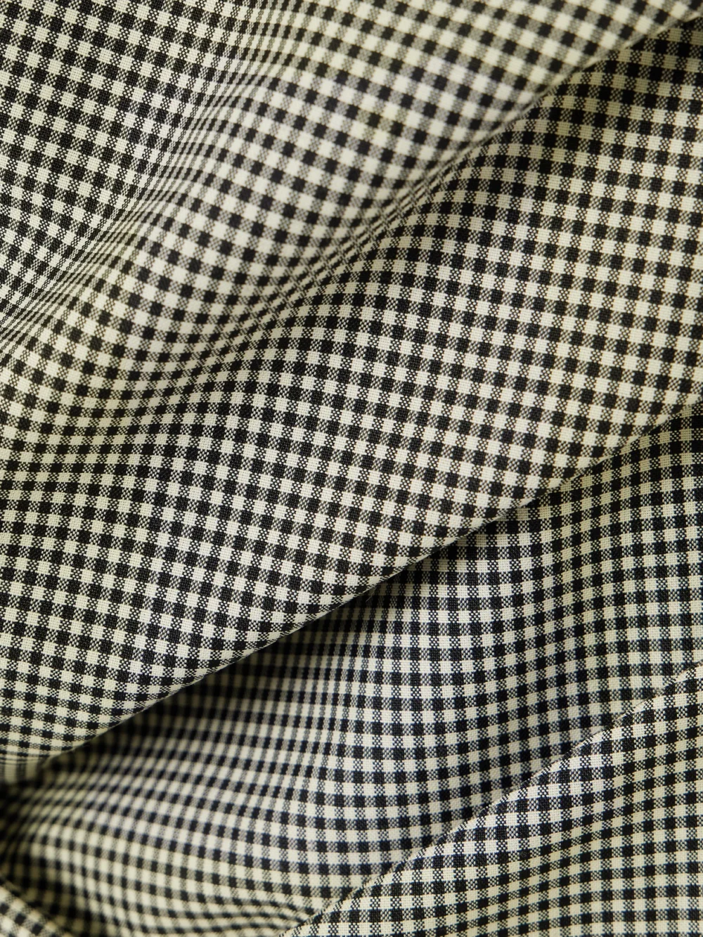 Close-up detail of the Róhe Gathered Gingham Wool-blend Top