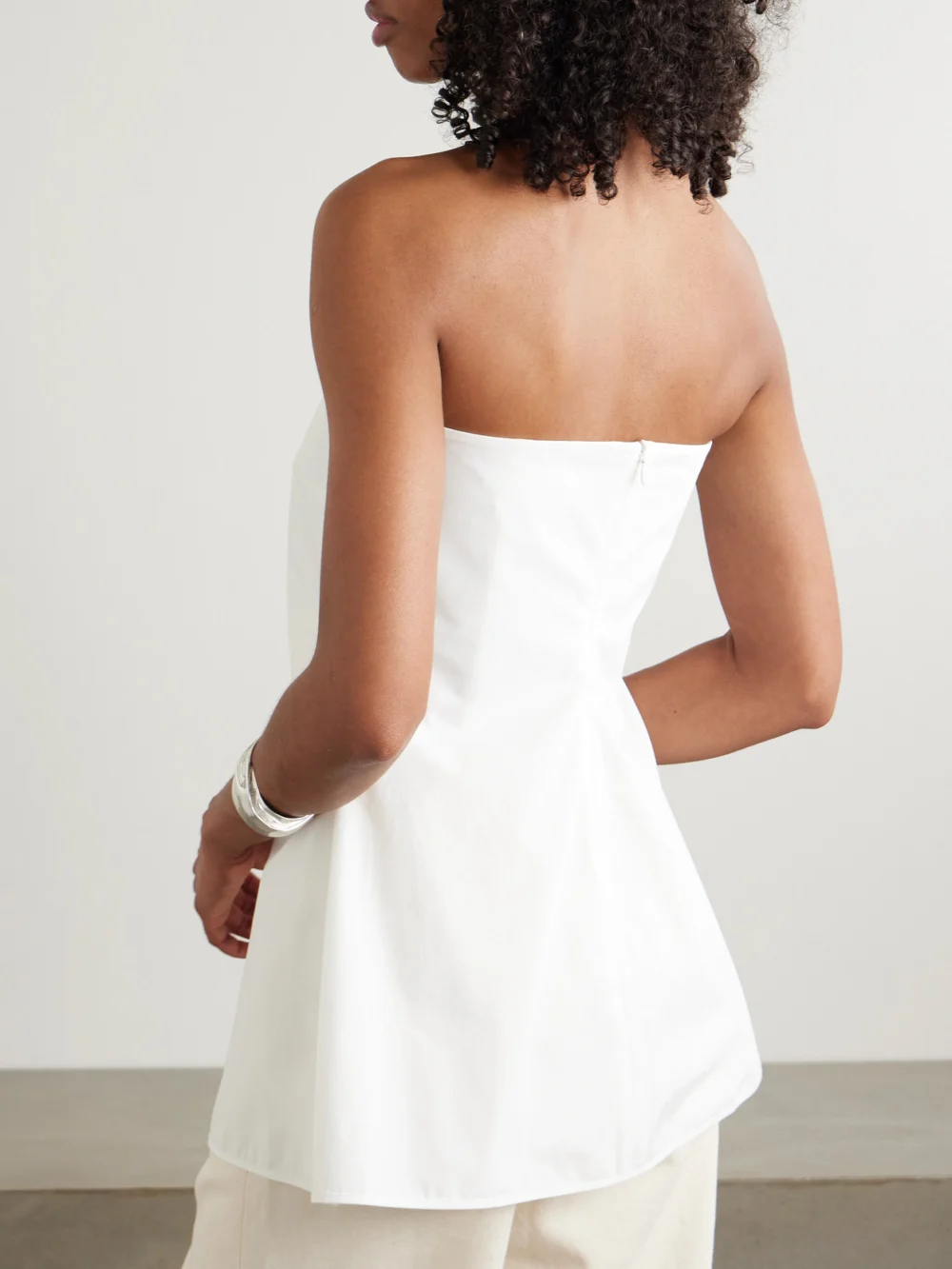 Back view of the Róhe Peplum Cotton-poplin Bustier Top