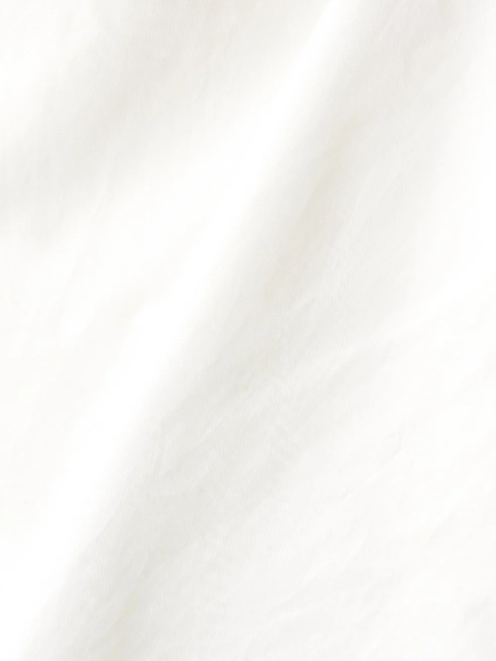 Close-up detail of the Róhe Peplum Cotton-poplin Bustier Top