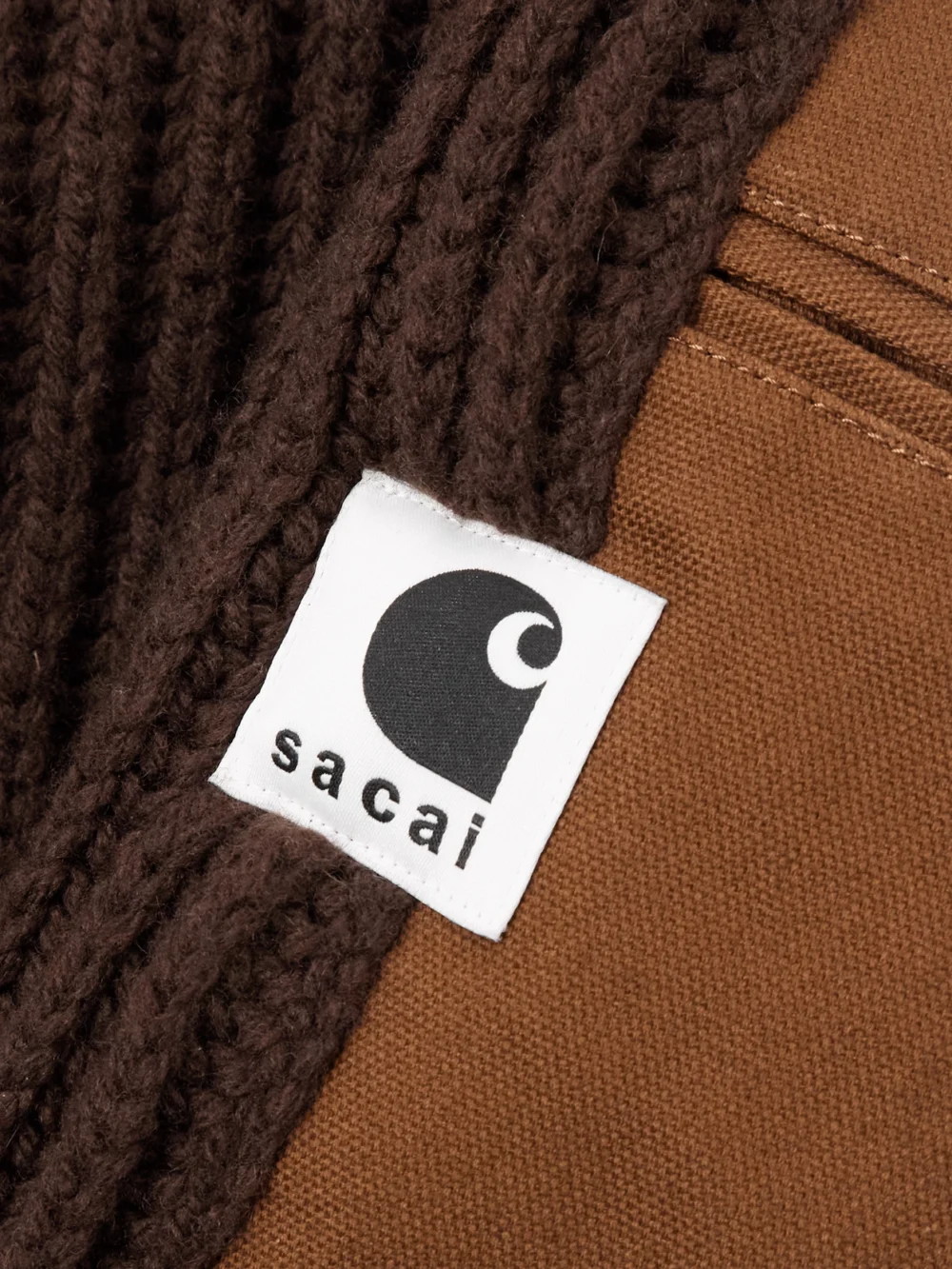 Close-up detail of the Sacai + Carhartt Wip Asymmetric Ribbed Wool-blend and Cotton-canvas Cardigan