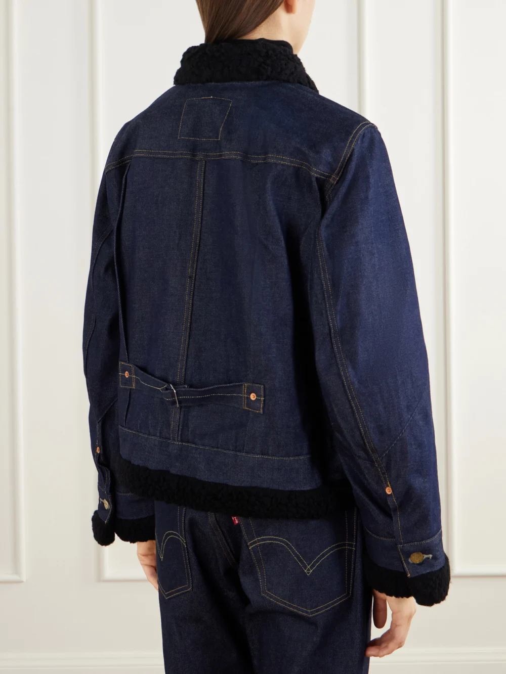 Back view of the Sacai + Levi's Plush and Leather-trimmed Denim Jacket