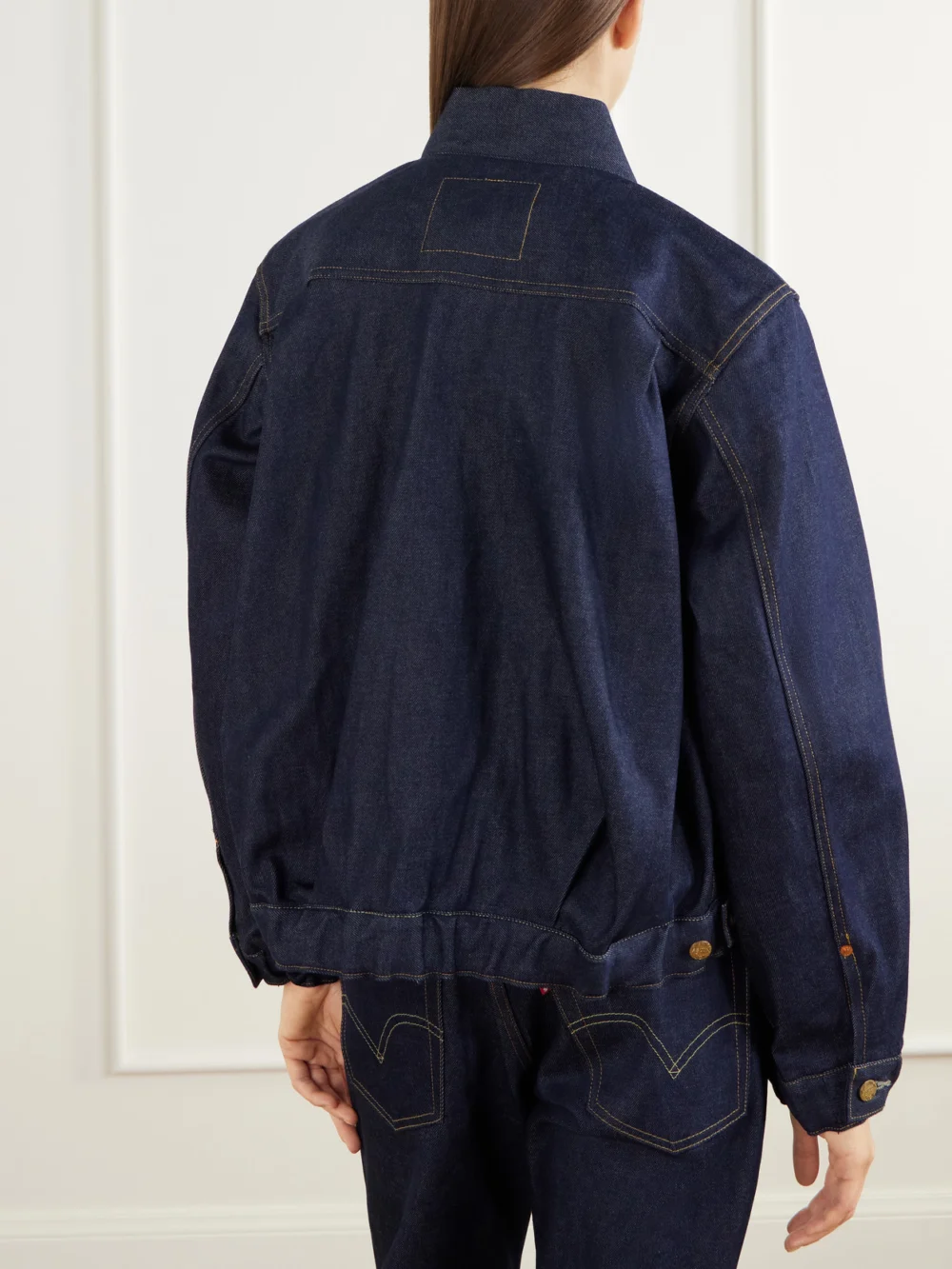 Back view of the Sacai + Levi's Washed Denim Bomber Jacket