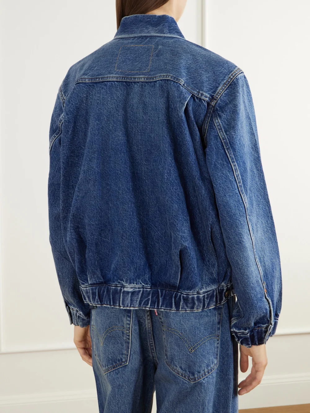 Back view of the Sacai + Levi's Washed Denim Bomber Jacket