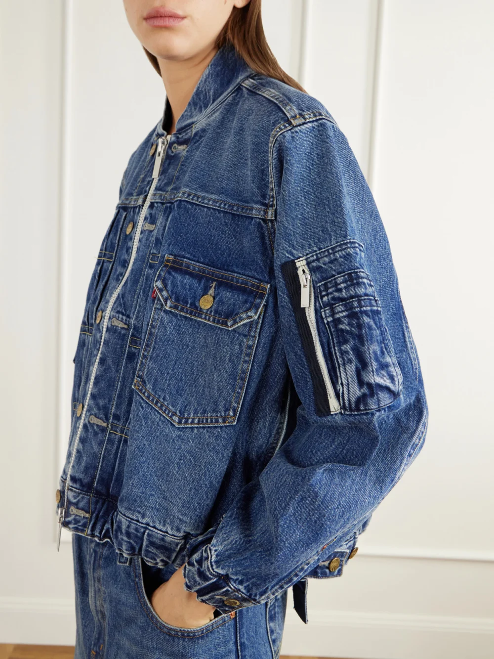 Close-up detail of the Sacai + Levi's Washed Denim Bomber Jacket