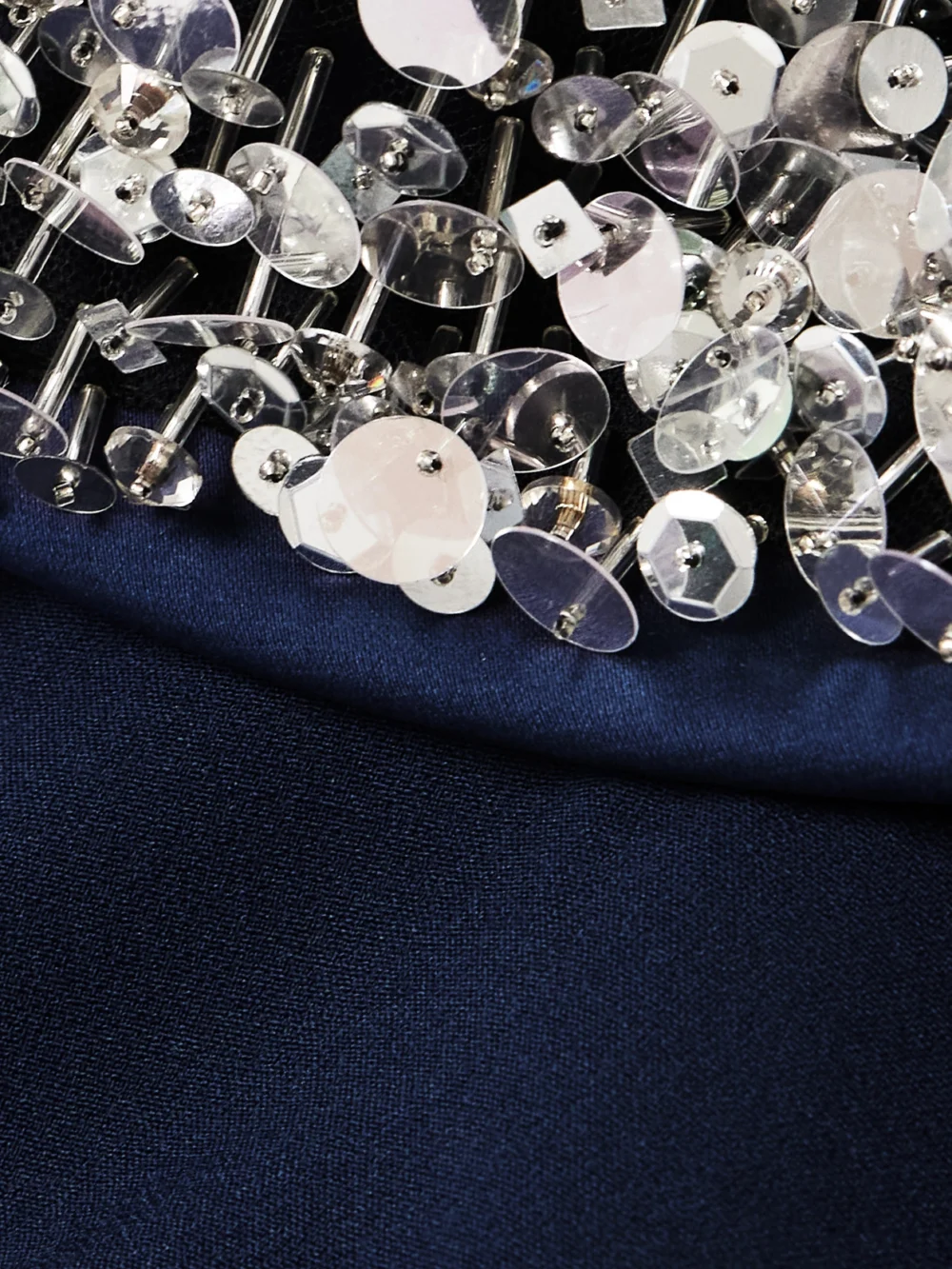 Close-up detail of the Safiyaa Luna Embellished Duchesse Satin-trimmed Crepe Jumpsuit