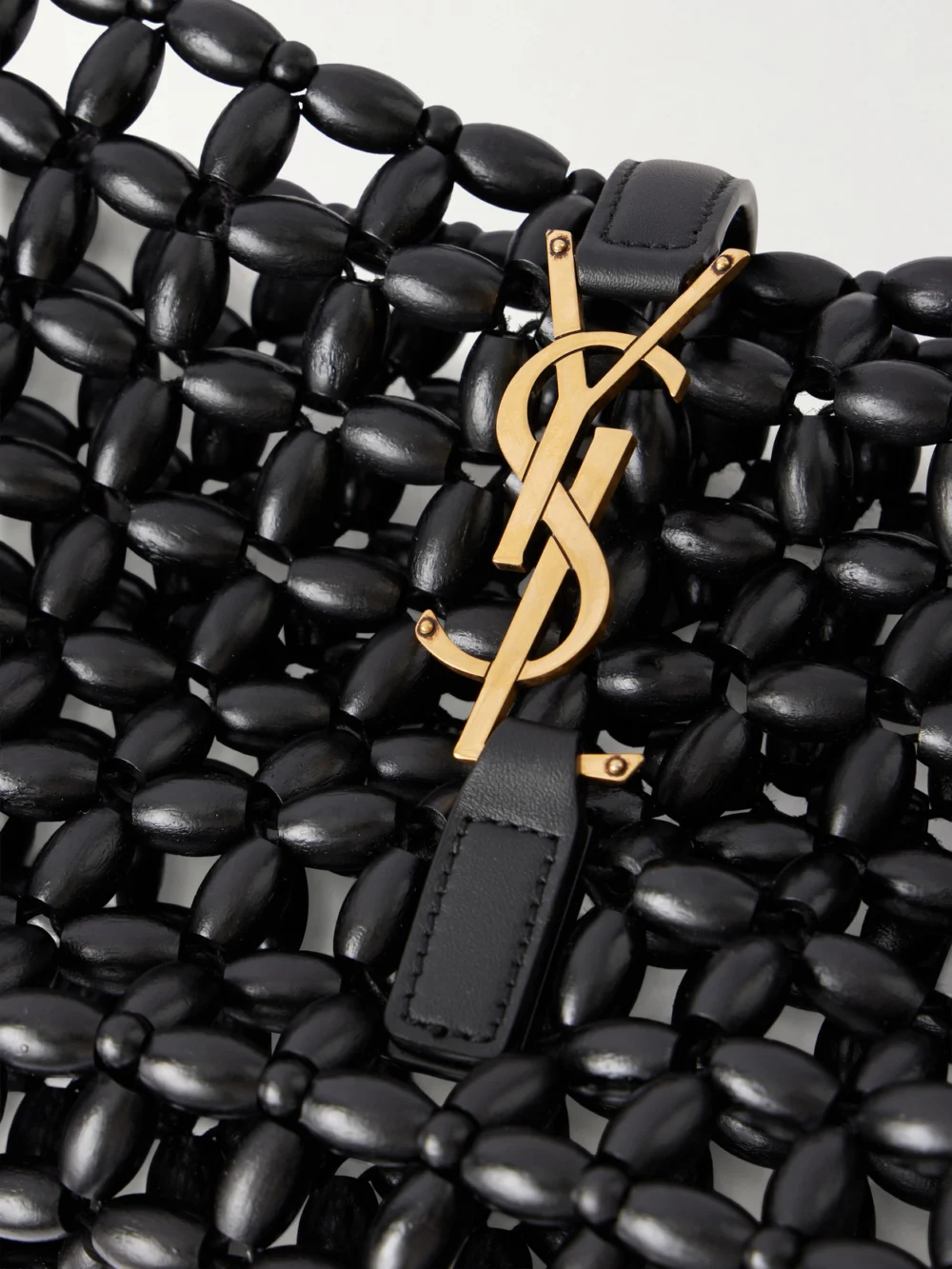Close-up detail of the Saint Laurent Le 5 À 7 Mini Leather-trimmed Beaded Wood Shoulder Bag