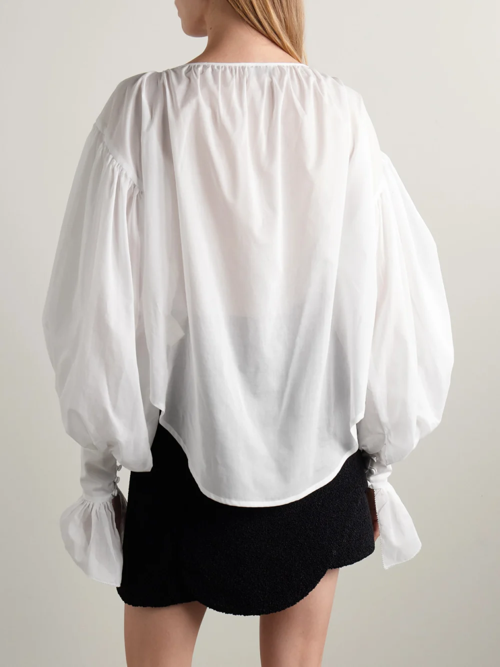 Back view of the Salon 1884 Giacomo Tie-neck Ruffled Cotton-voile Blouse