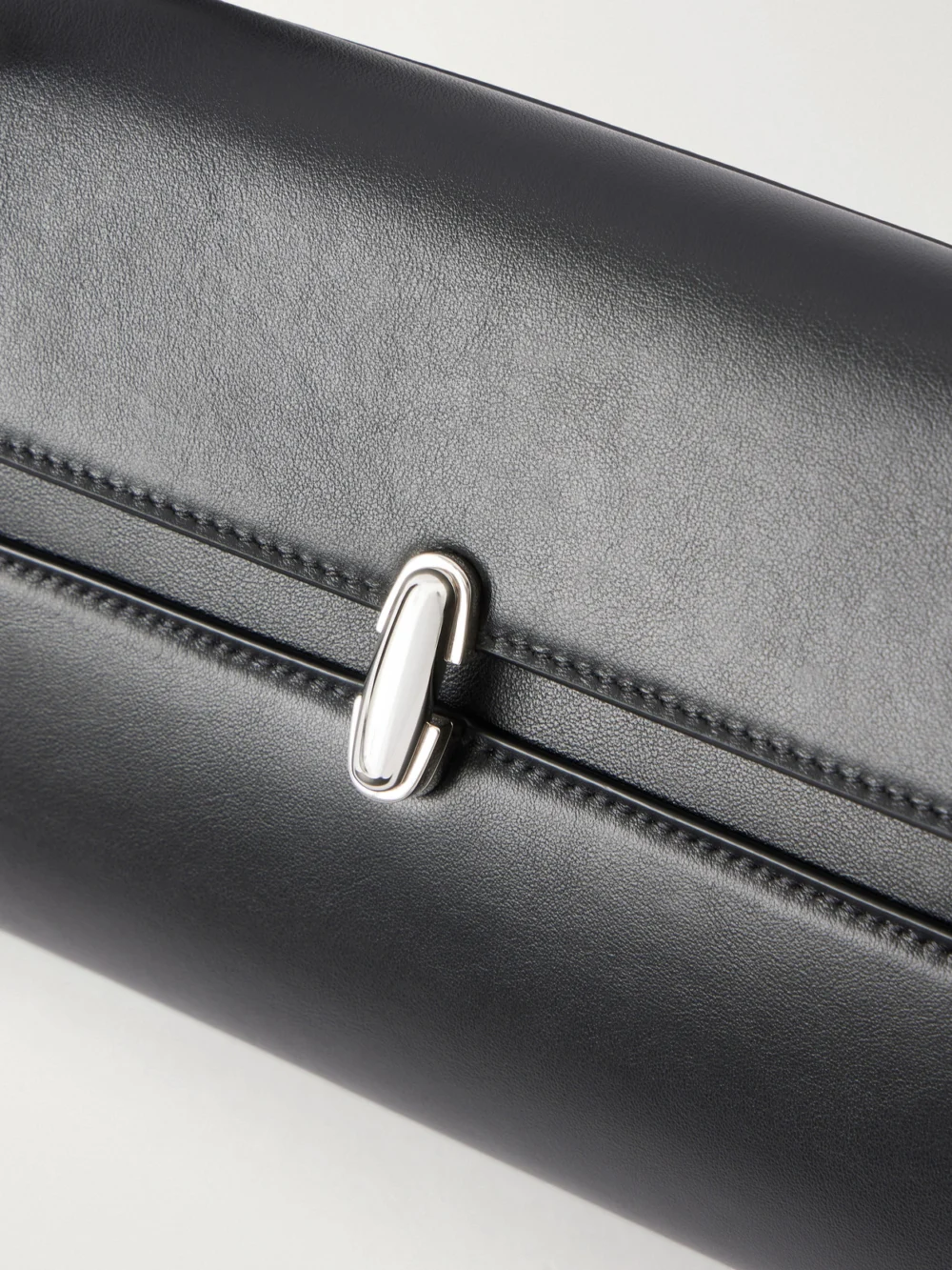 Close-up detail of the Savette Symmetry Trapeze Leather Shoulder Bag