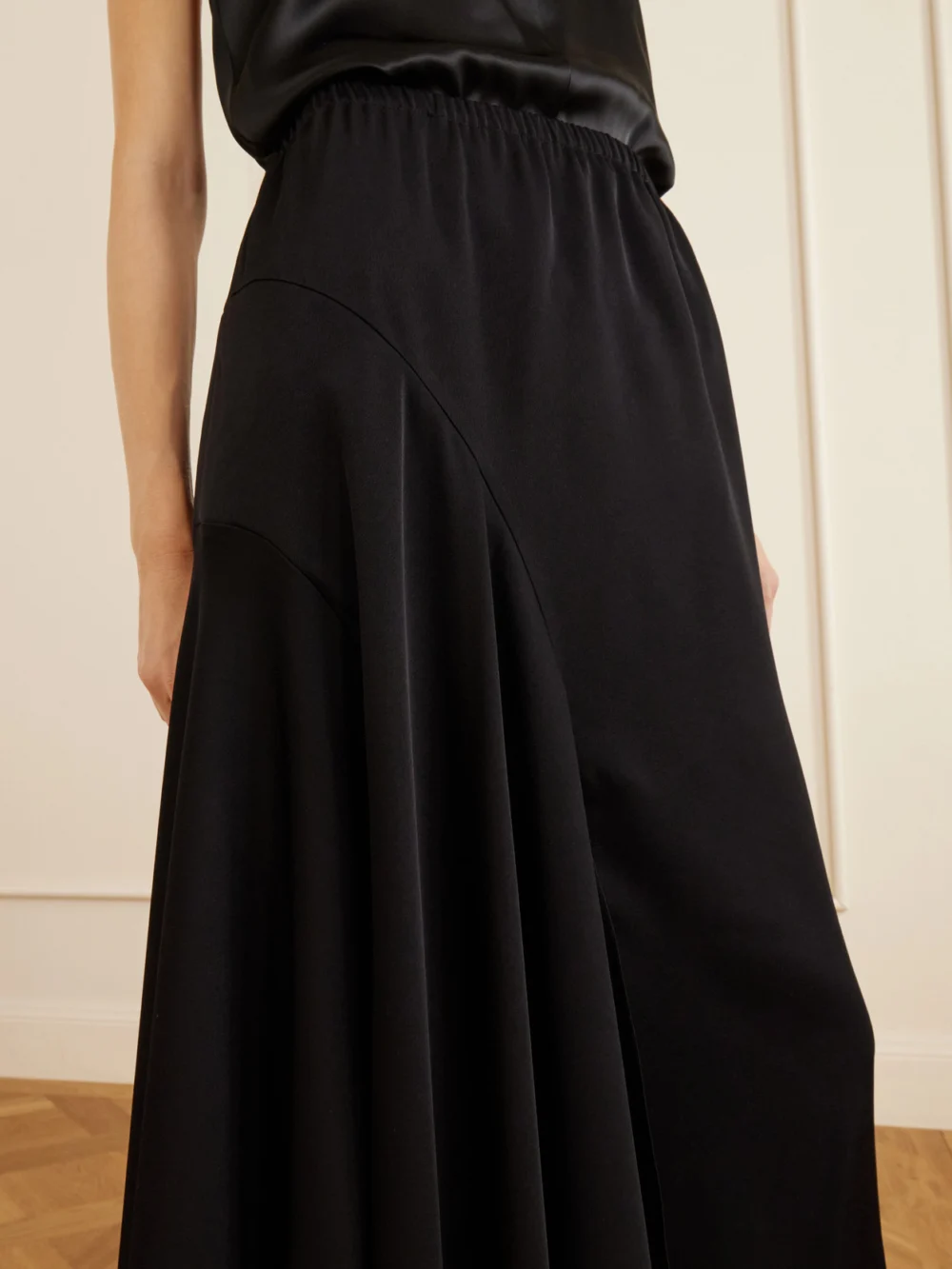Close-up detail of the Sharon Wauchob Tria Asymmetric Duchess-satin Midi Skirt