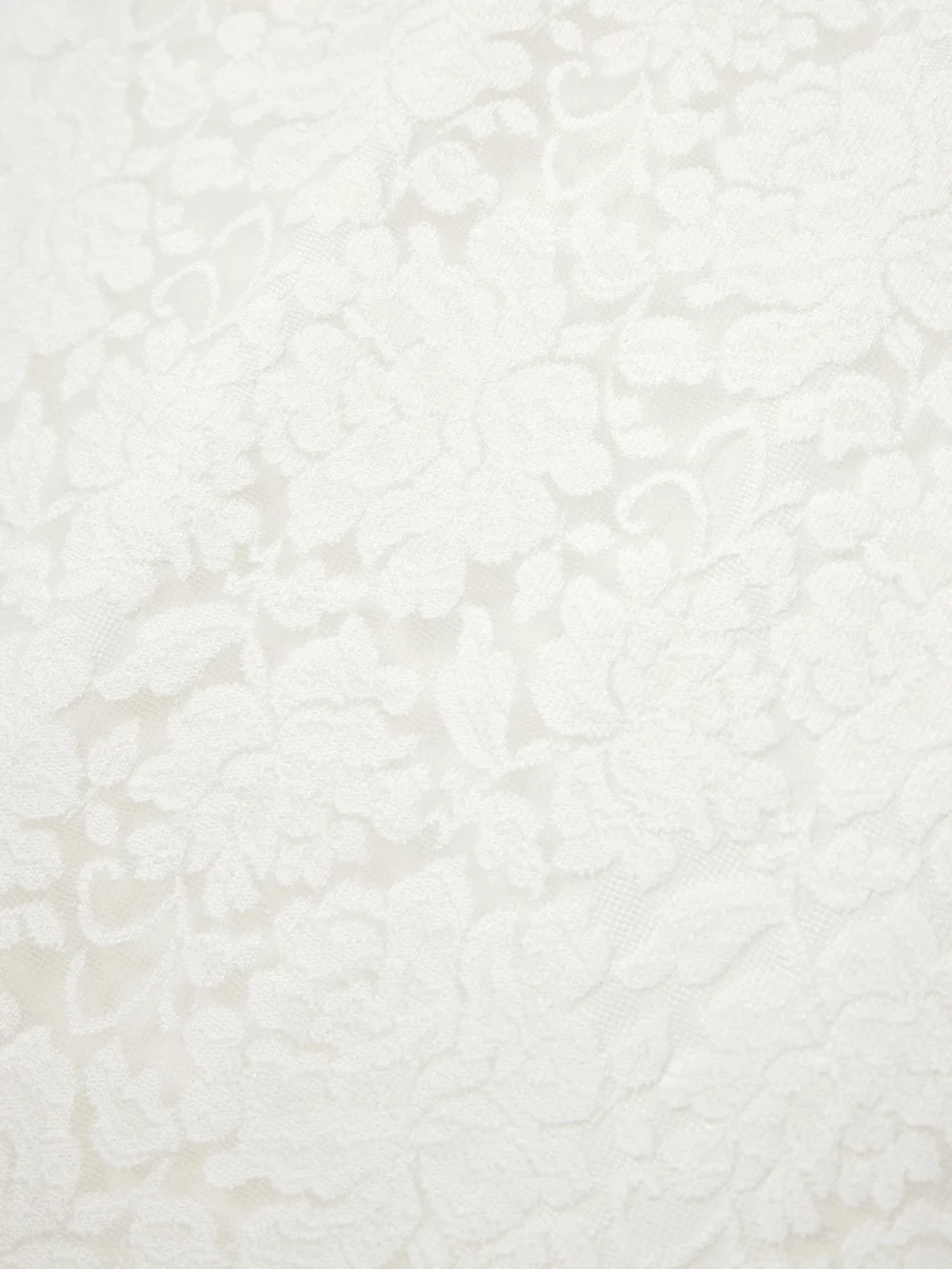Close-up detail of the Shushu/Tong Bow-embellished Satin-trimmed Lace Midi Skirt
