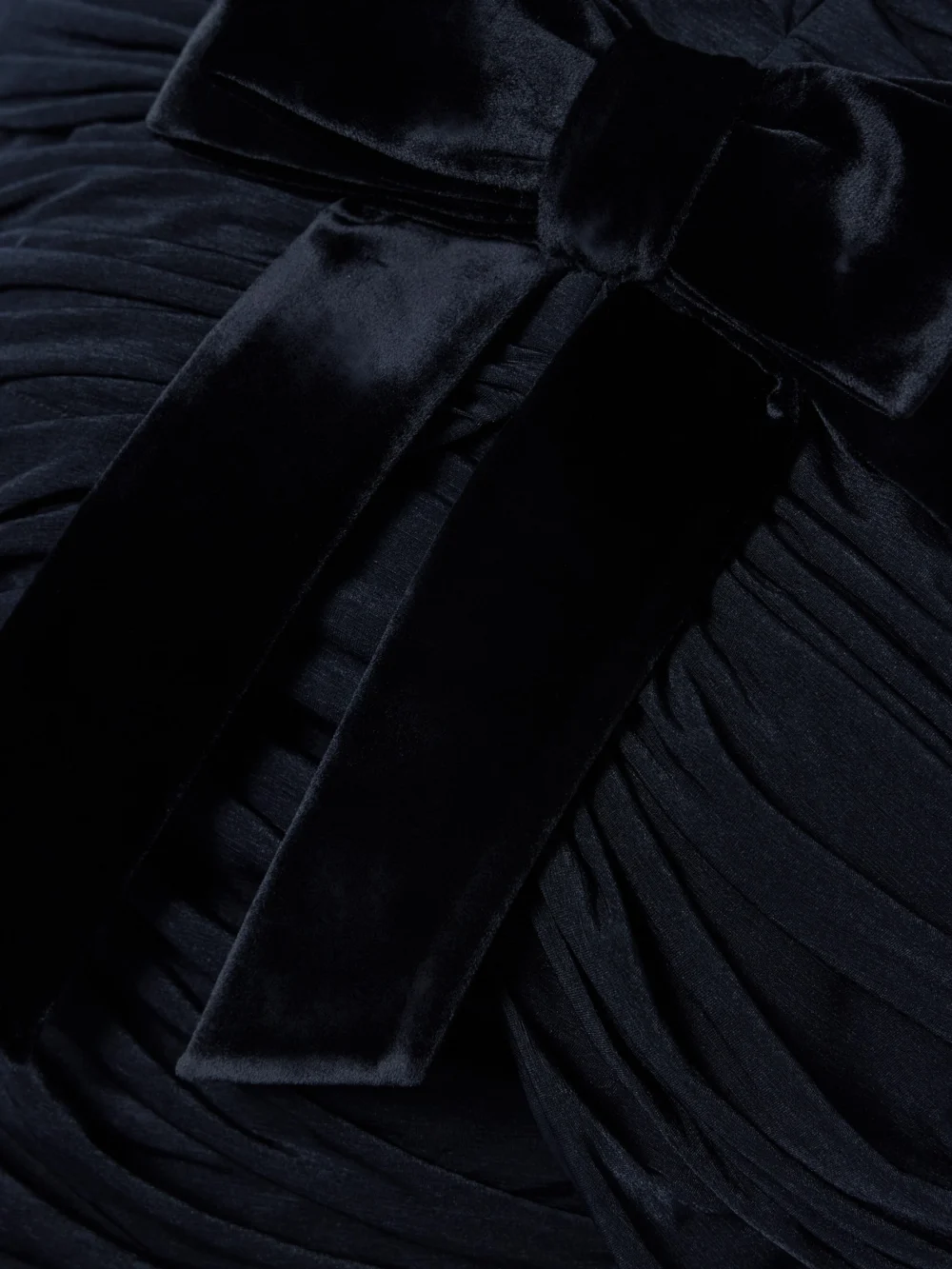 Close-up detail of the Shushu/Tong Bow-embellished Velvet-trimmed Gathered Jersey Mini Dress