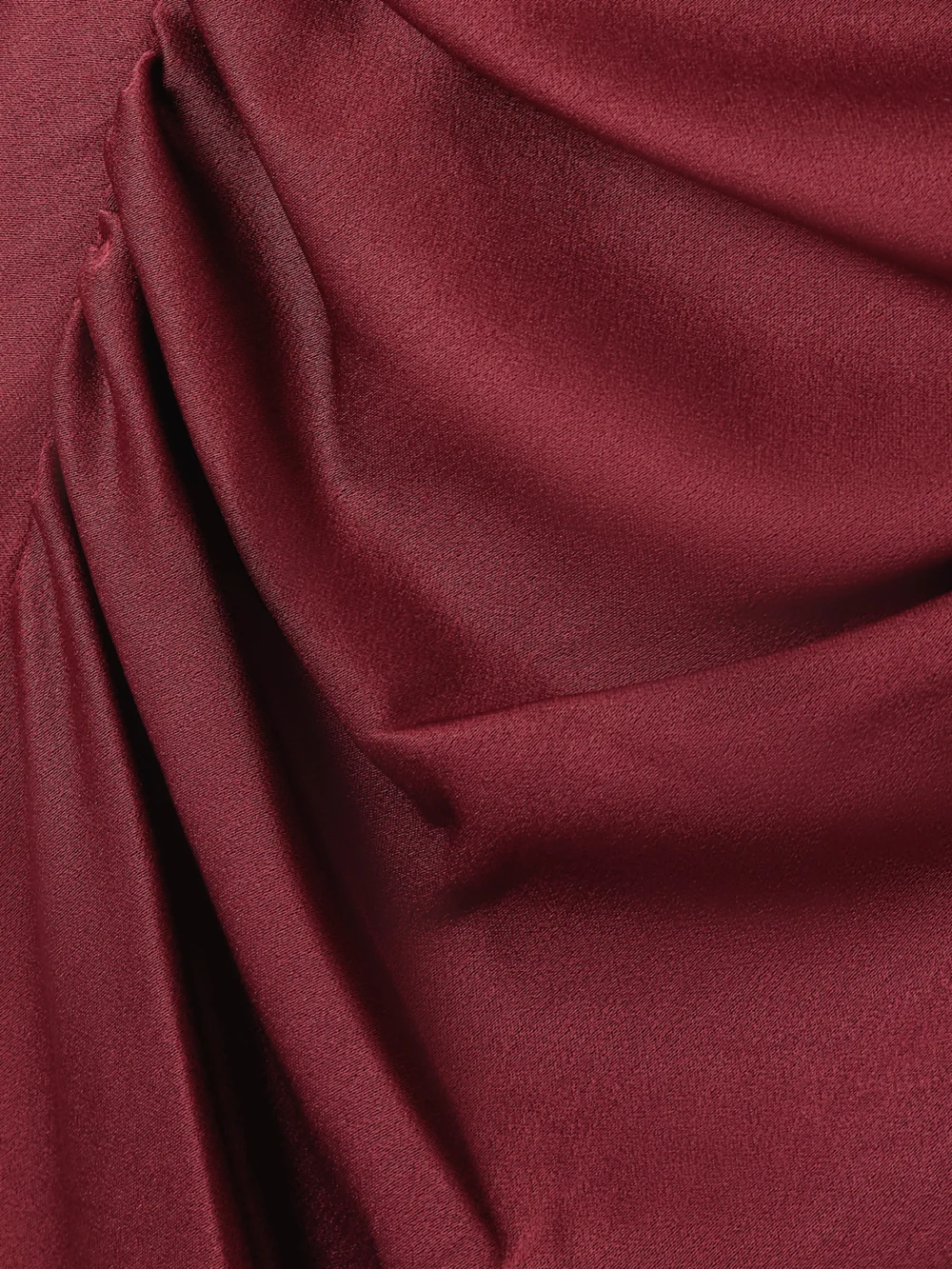 Close-up detail of the Simkhai Burke Draped Satin Midi Dress